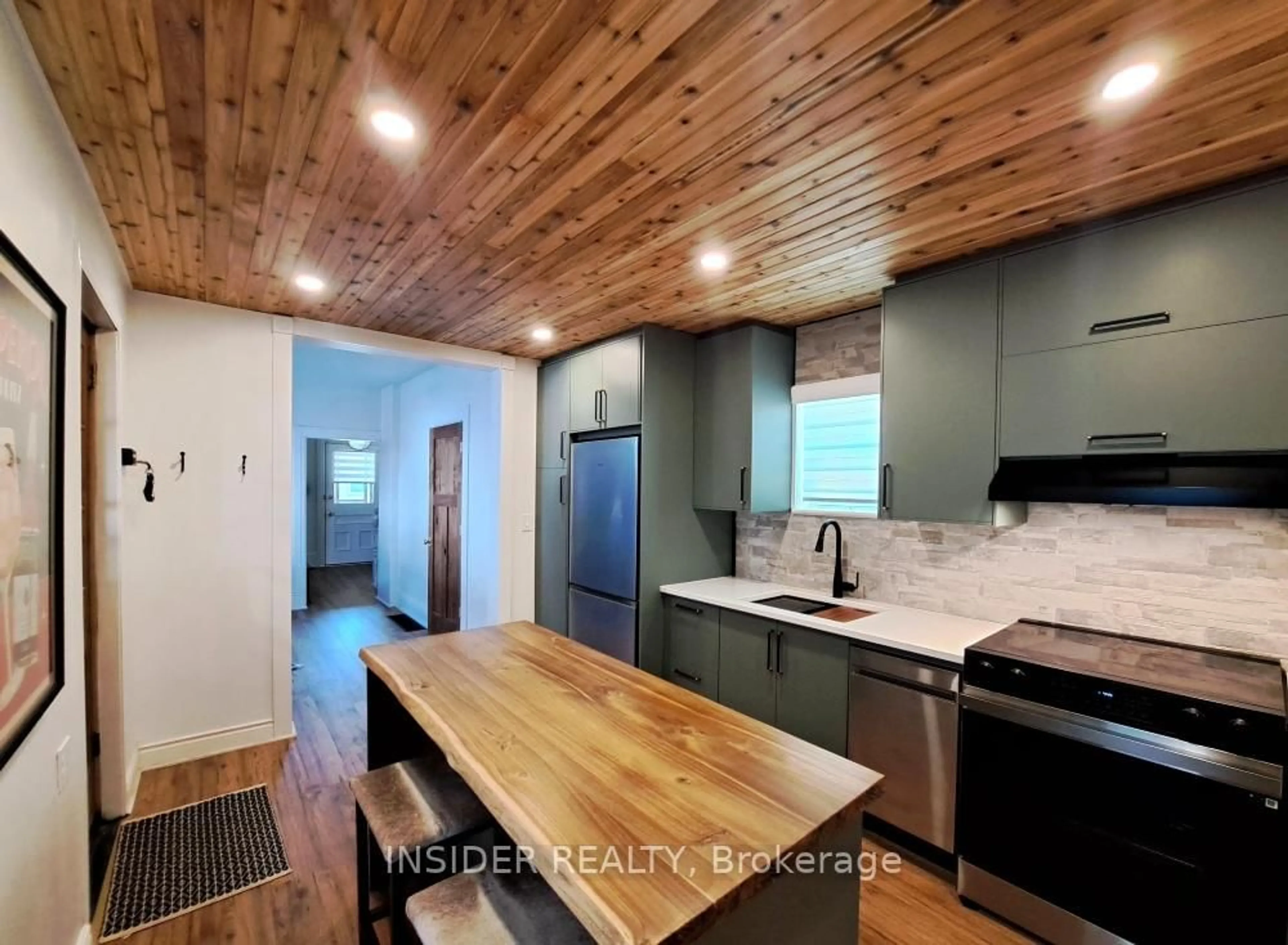 Open concept kitchen, wood/laminate floor for 658 Brown St, Peterborough Ontario K9J 4K5