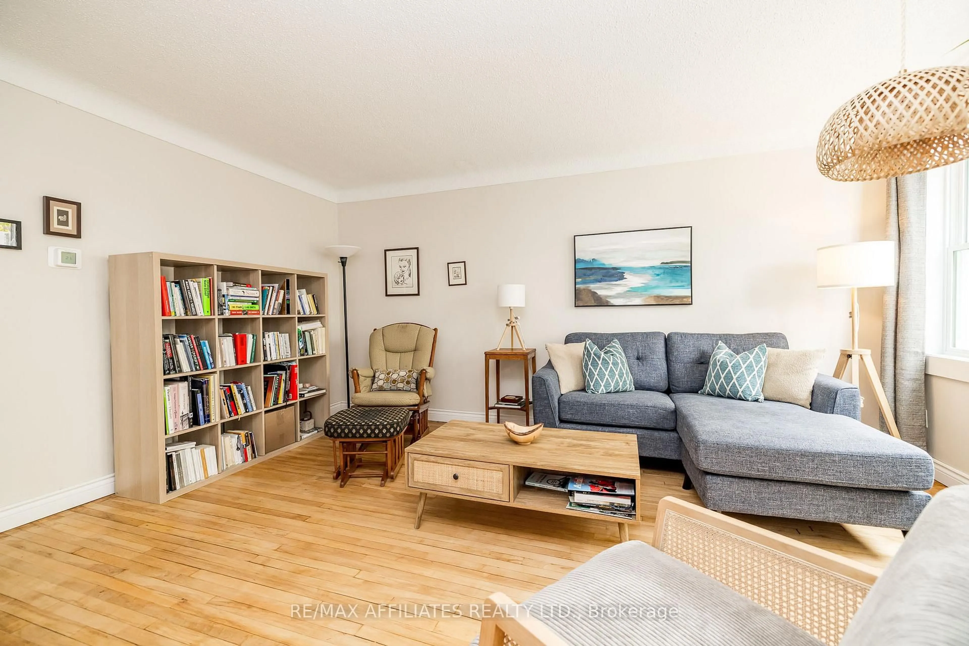 Living room with furniture, wood/laminate floor for 361 Larouche St, Ottawa Ontario K1L 7L1