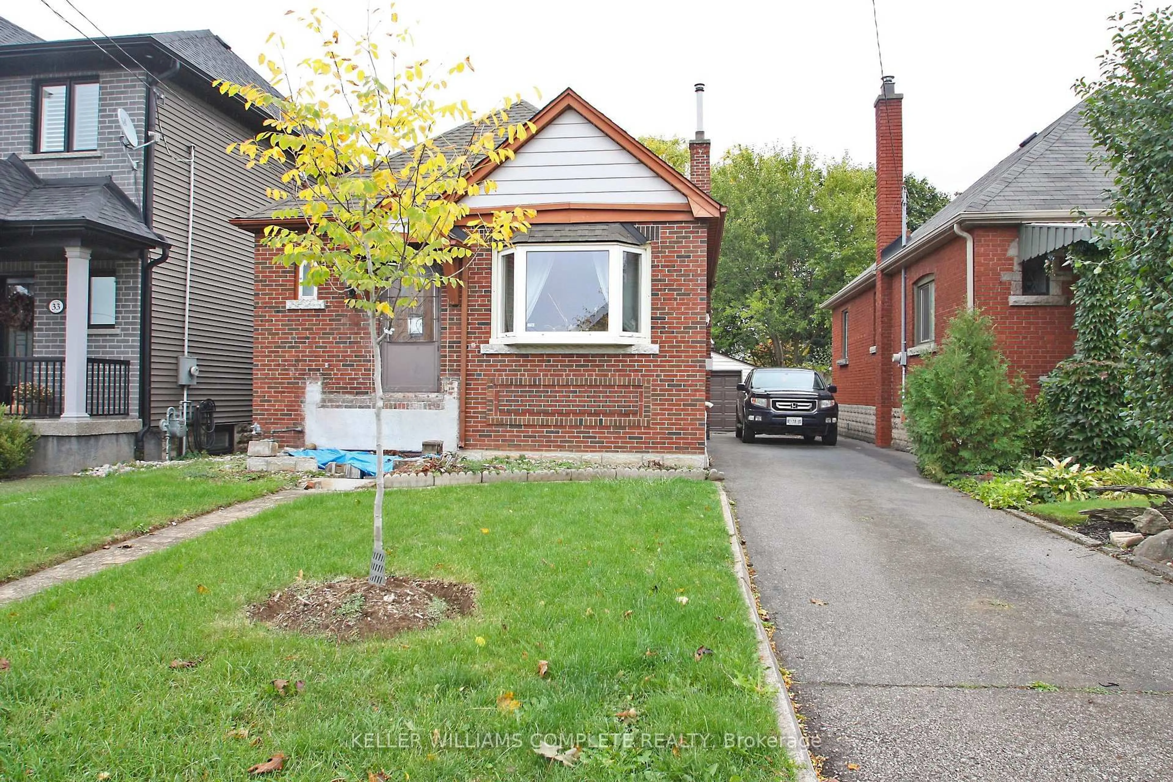 Home with brick exterior material, street for 35 Barons Ave, Hamilton Ontario L8K 2Y1
