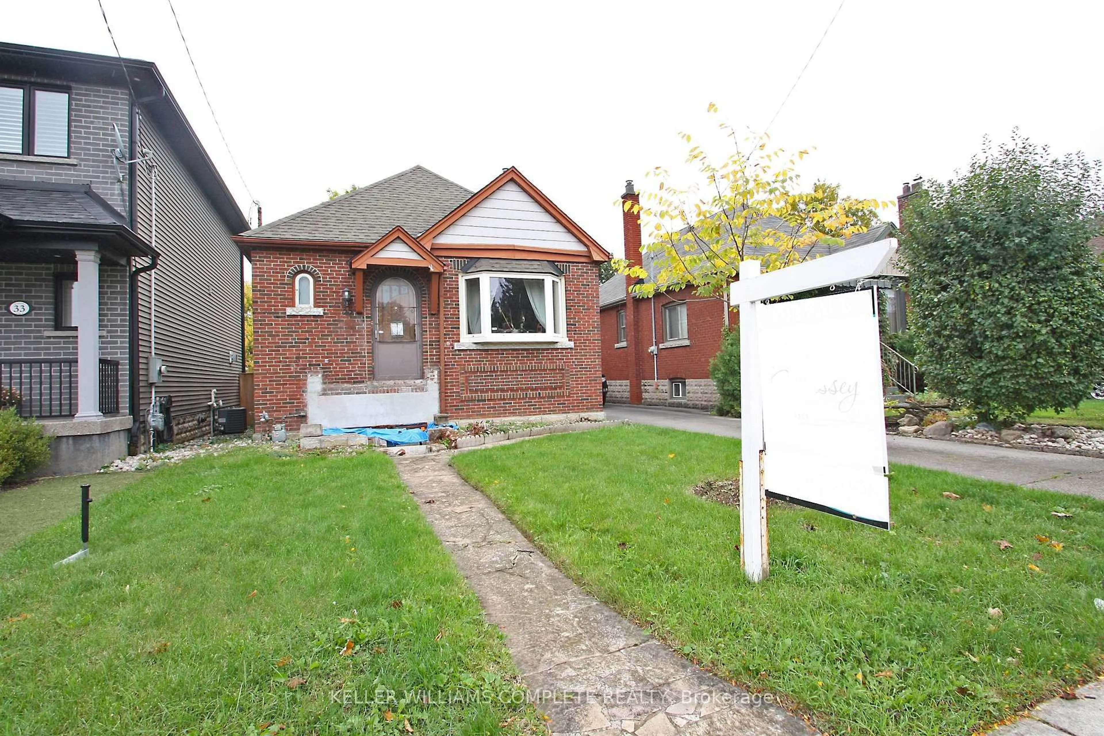 Home with brick exterior material, street for 35 Barons Ave, Hamilton Ontario L8K 2Y1