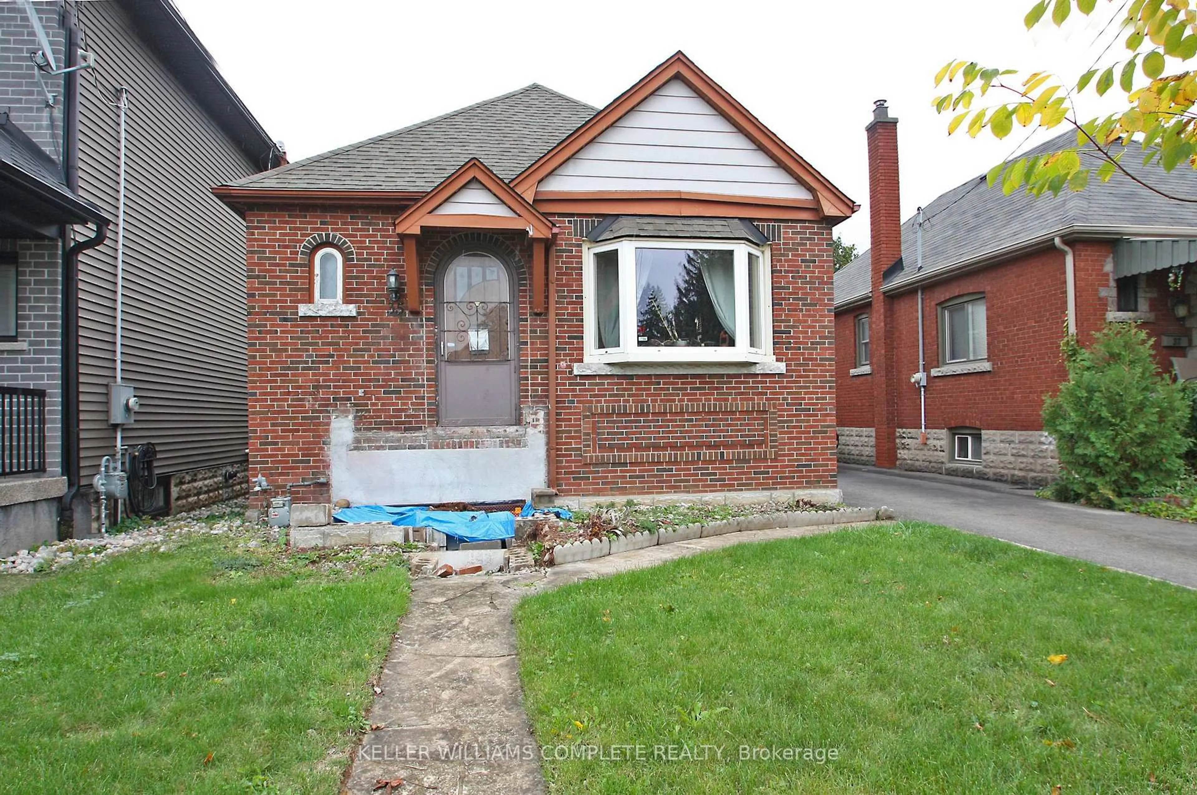 Home with brick exterior material, street for 35 Barons Ave, Hamilton Ontario L8K 2Y1