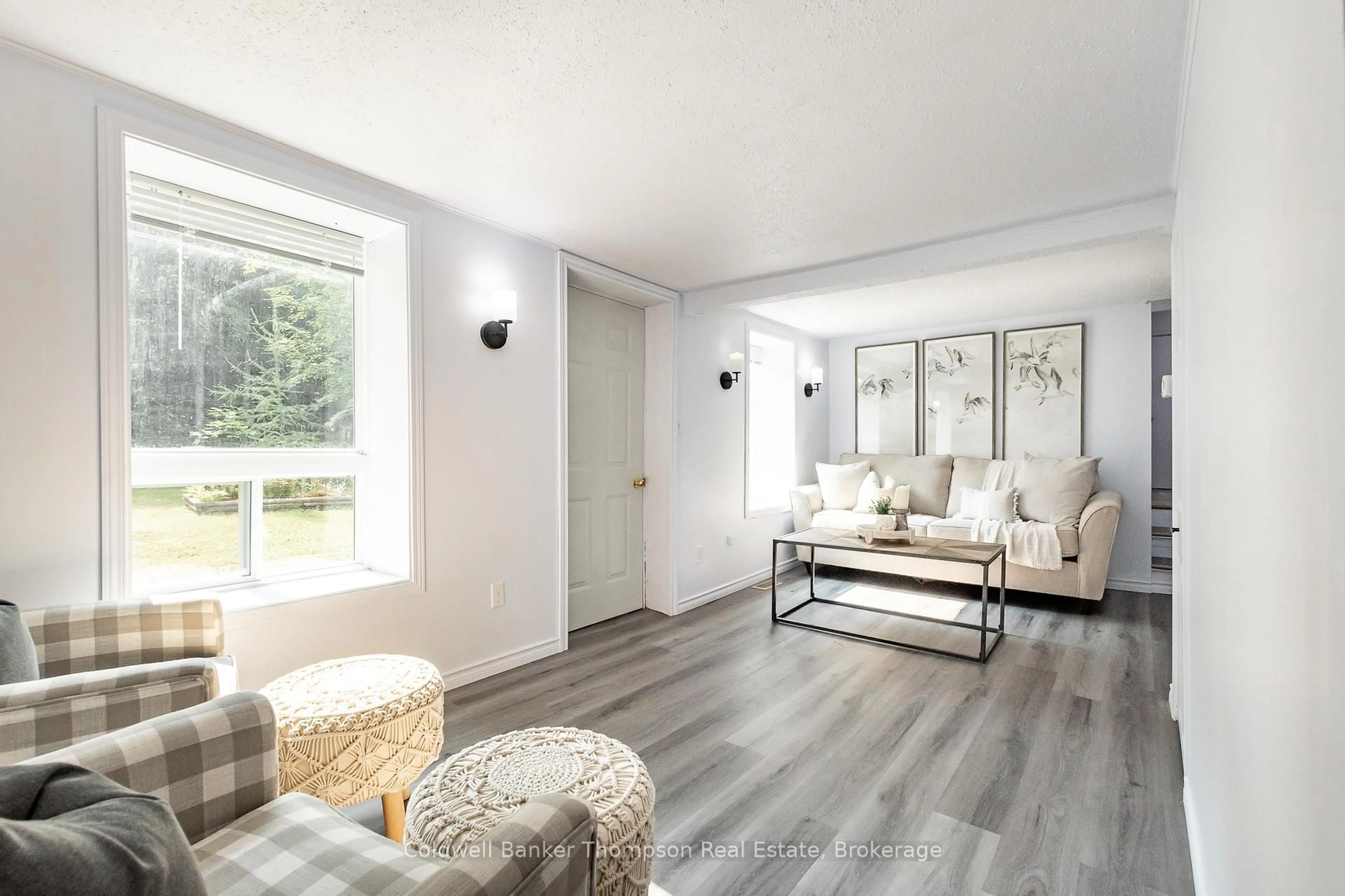 Living room with furniture, wood/laminate floor for 1980 Lone Pine Dr, Huntsville Ontario P0B 1L0