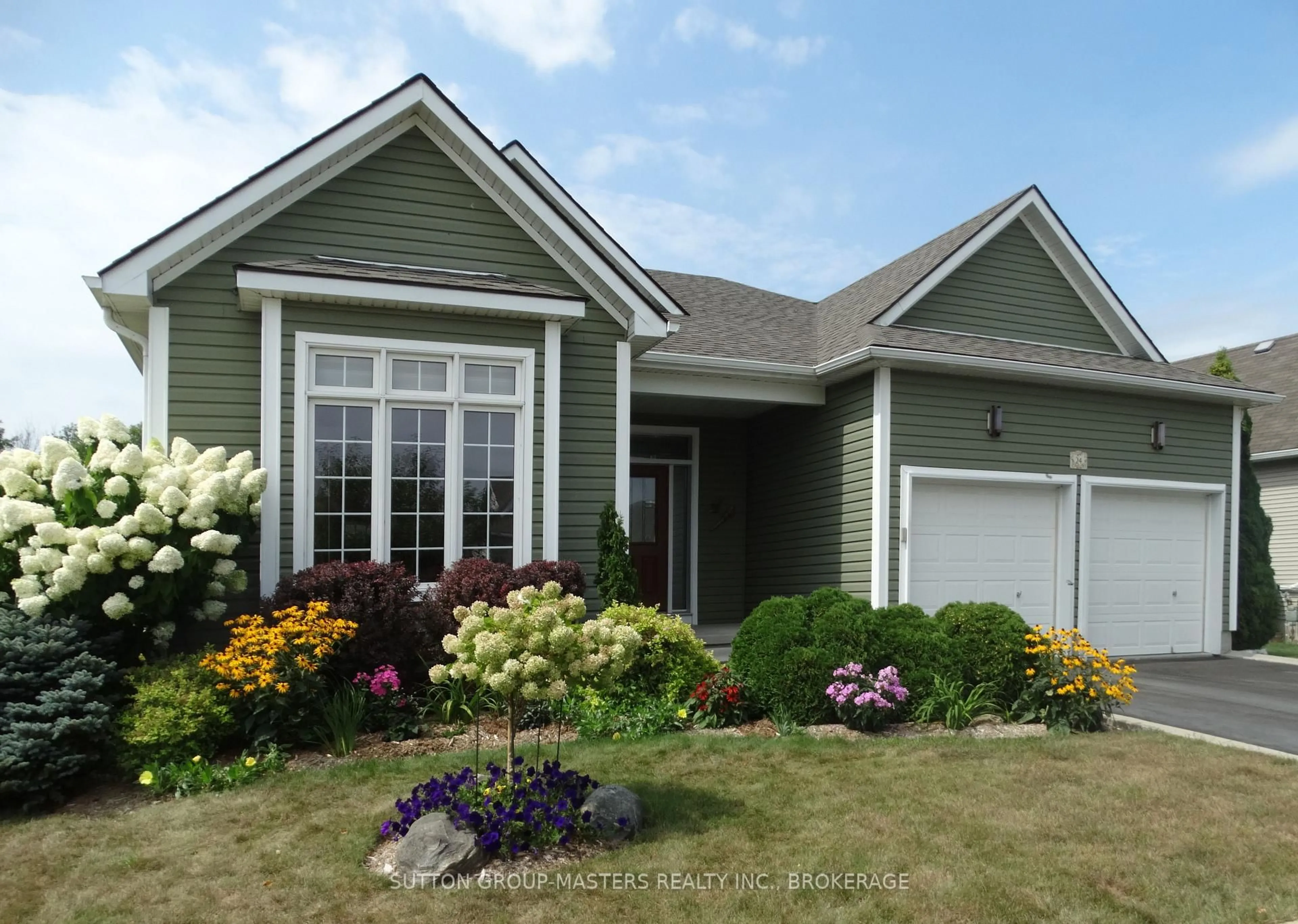 Home with vinyl exterior material, street for 24 Country Club Dr, Bath Ontario K0H 1G0