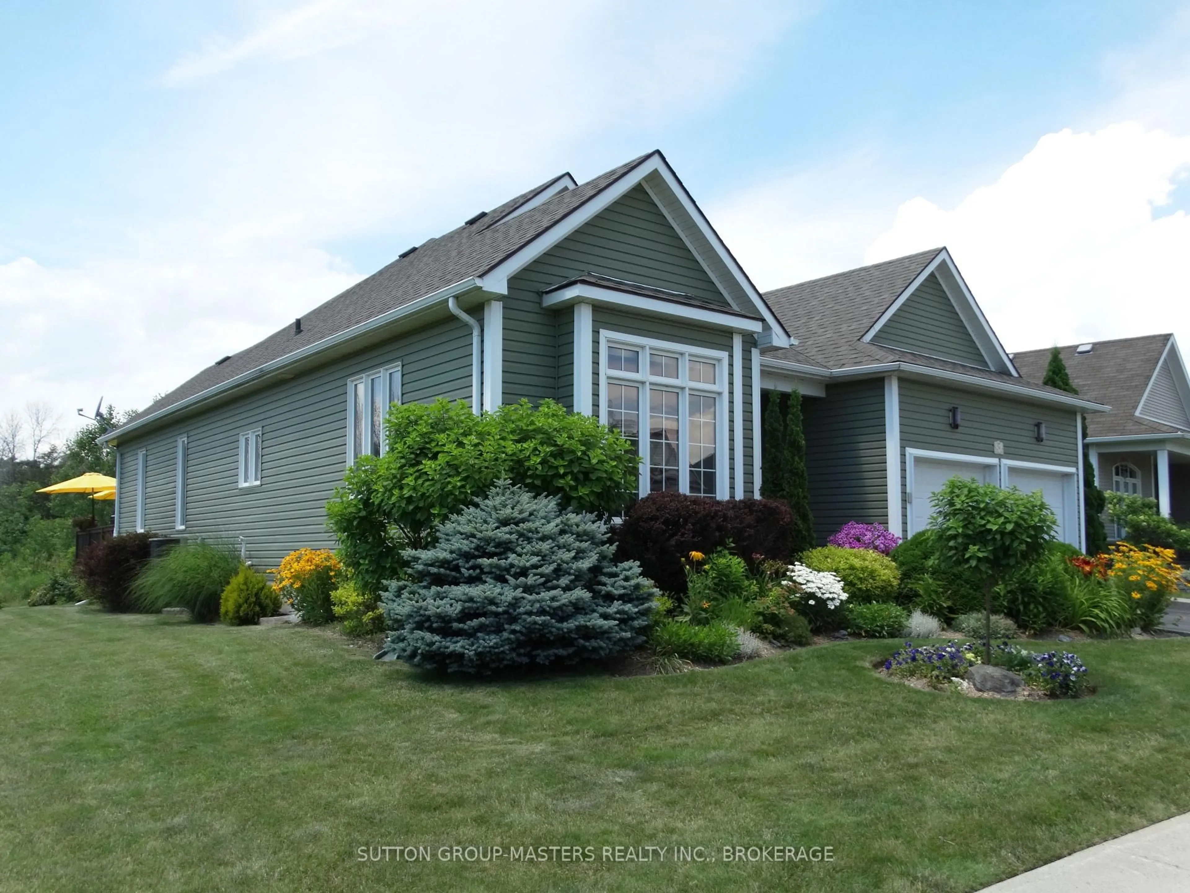 Home with vinyl exterior material, street for 24 Country Club Dr, Bath Ontario K0H 1G0