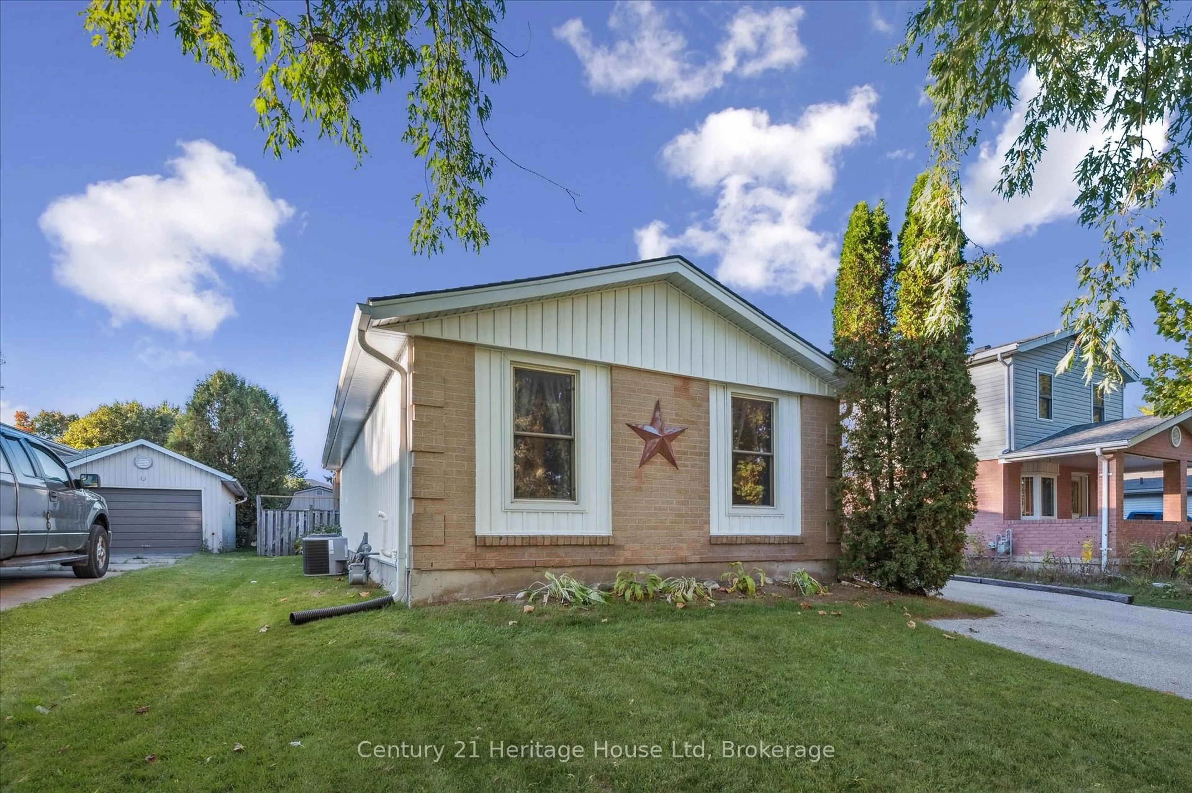 Home with vinyl exterior material, street for 345 Stornoway Dr, Centre Wellington Ontario N1M 3K9