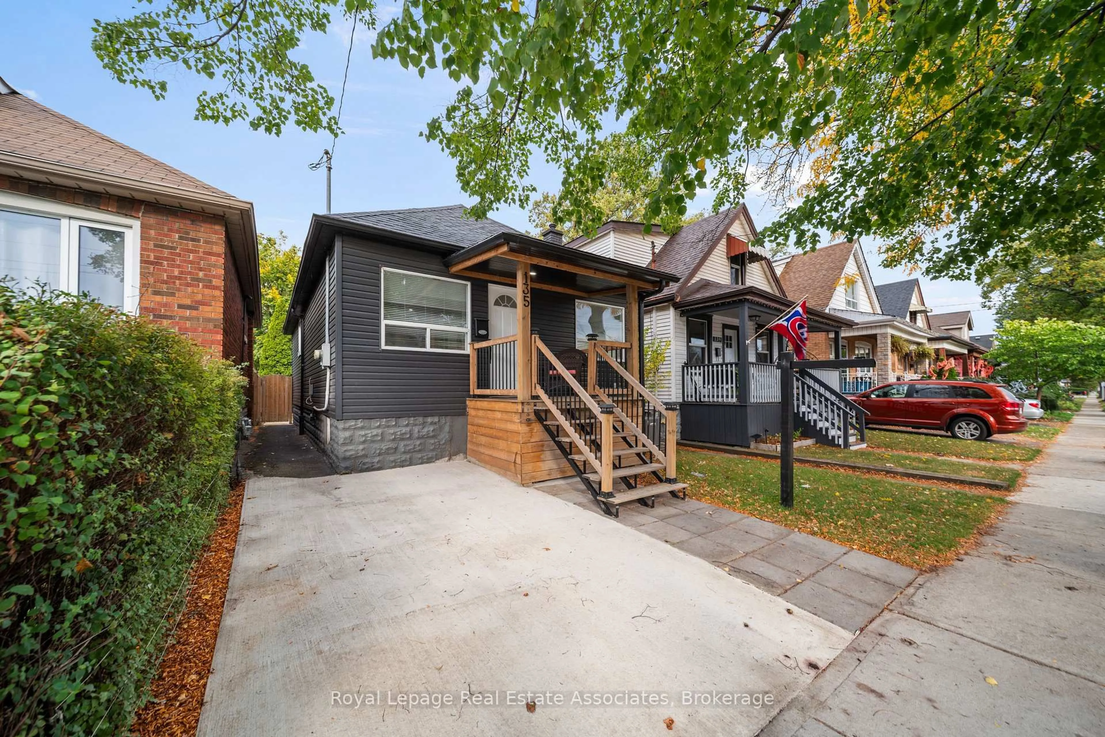 Home with brick exterior material, street for 135 Tragina Ave, Hamilton Ontario L8H 5C7