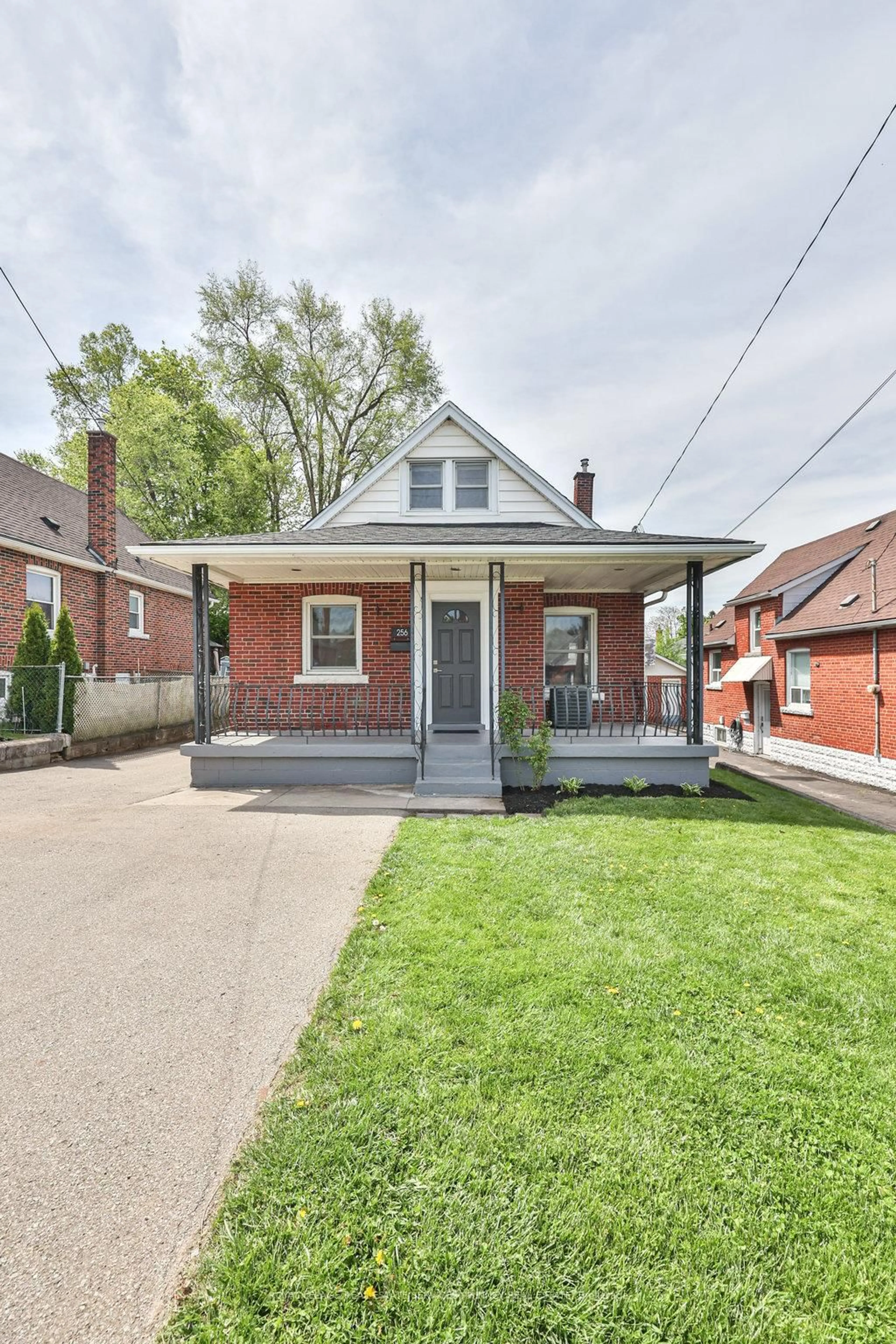 Home with brick exterior material, street for 256 Walter Ave, Hamilton Ontario L8K 3L4