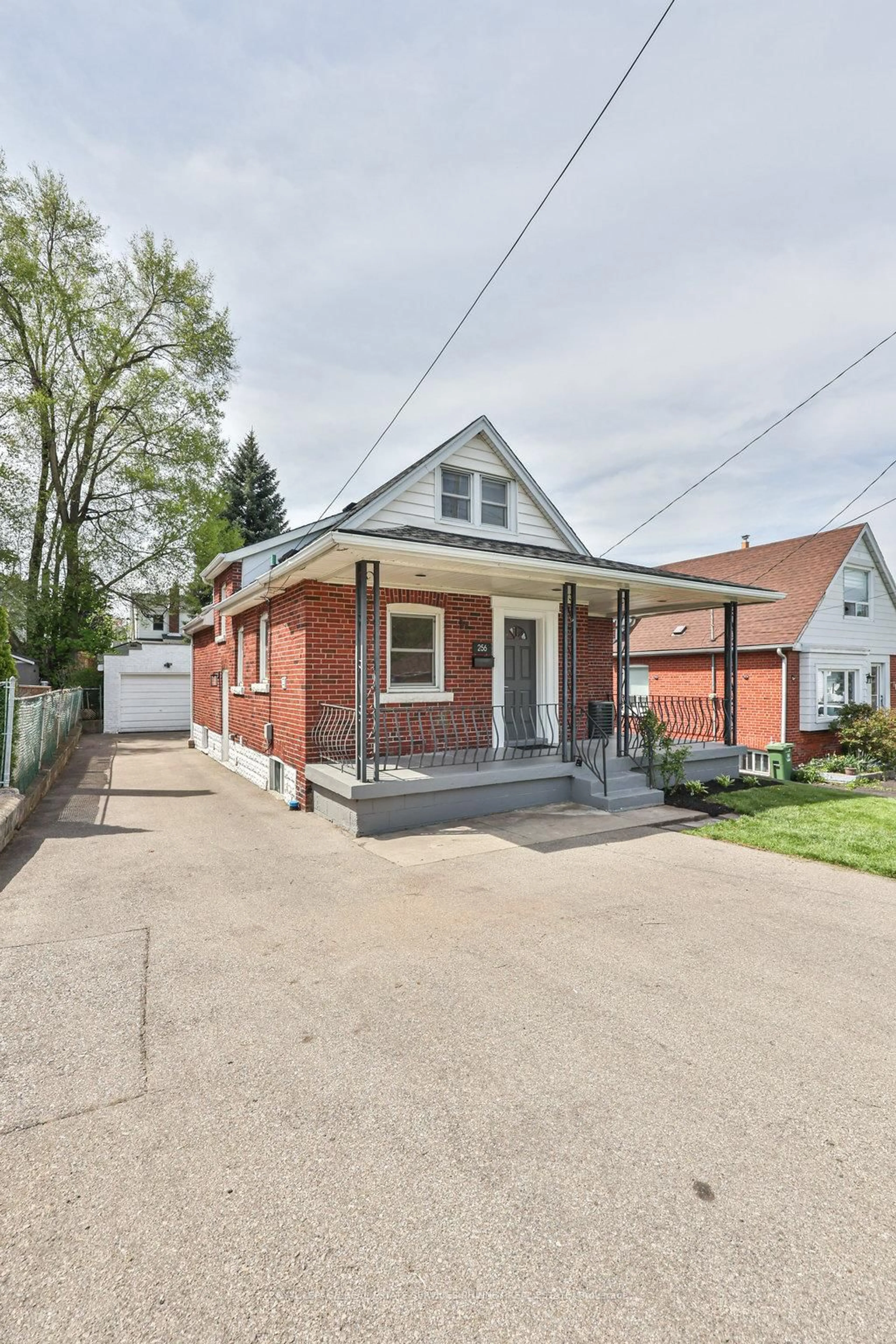 Home with brick exterior material, street for 256 Walter Ave, Hamilton Ontario L8K 3L4