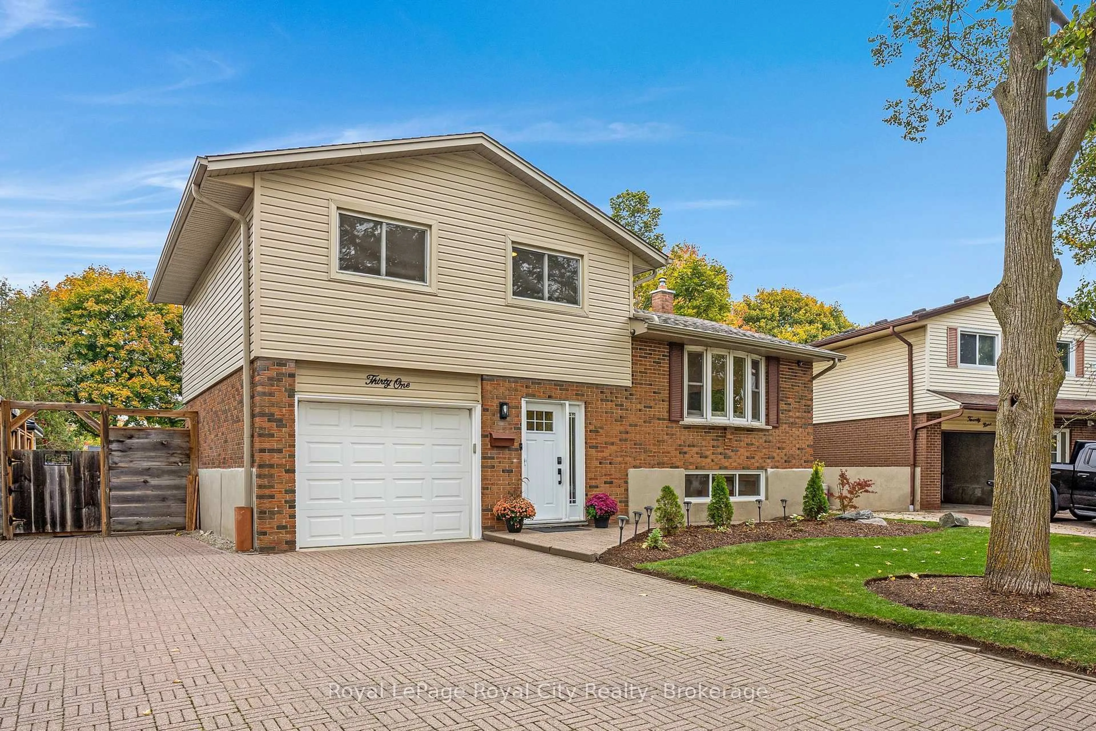 Home with brick exterior material, street for 31 Lambert Cres, Guelph Ontario N1G 2R4