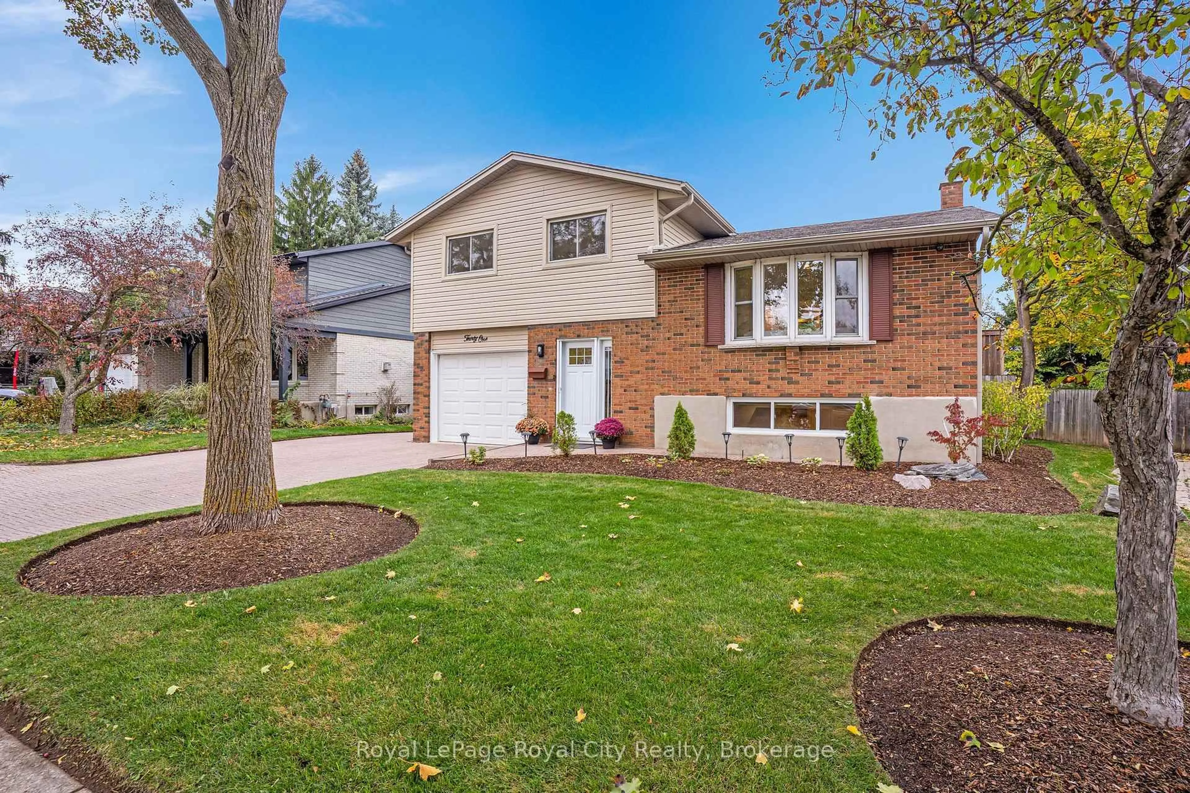 Home with brick exterior material, street for 31 Lambert Cres, Guelph Ontario N1G 2R4