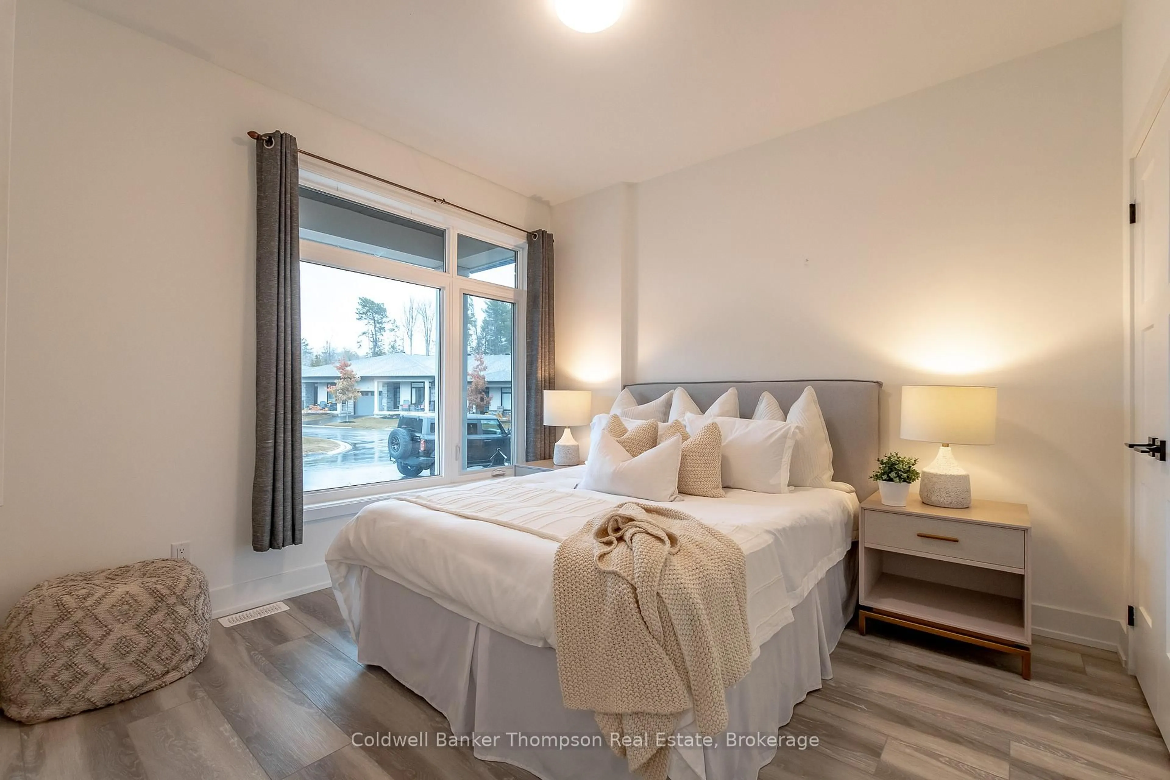 Bedroom with bed, wood/laminate floor for 37 Jack St, Huntsville Ontario P1H 0G4