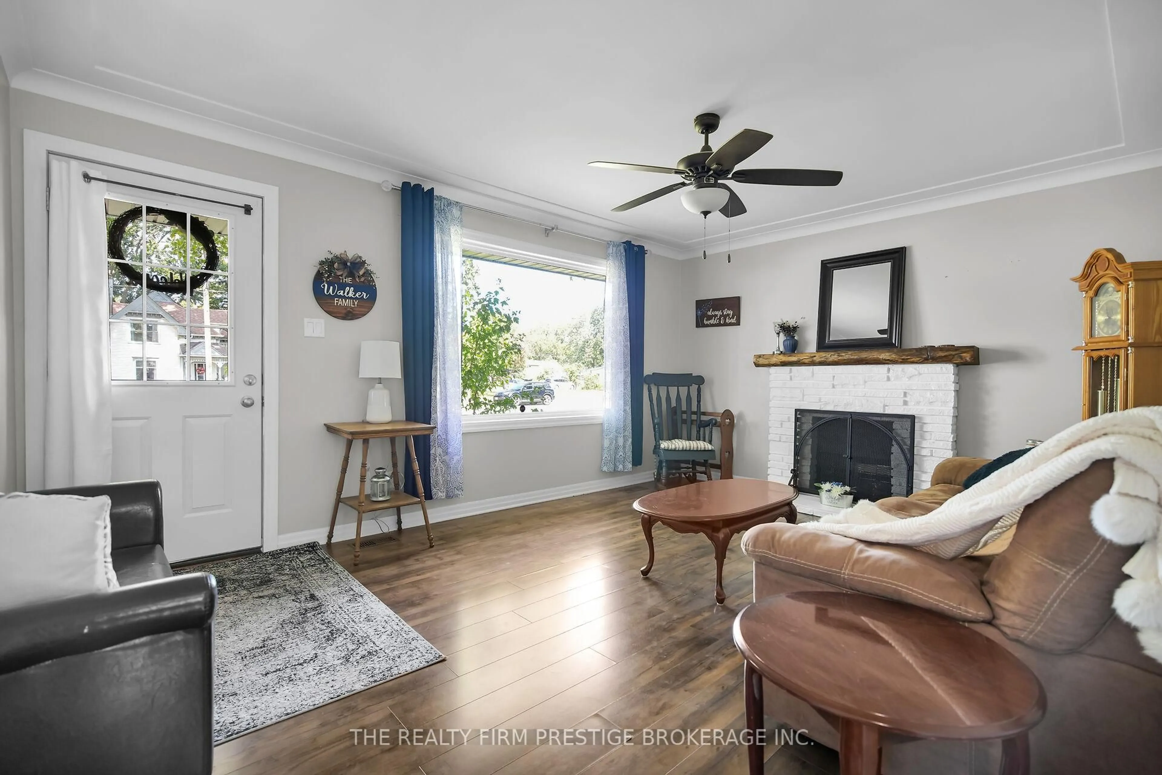 Living room with furniture, wood/laminate floor for 204 Main St, West Elgin Ontario N0L 2P0