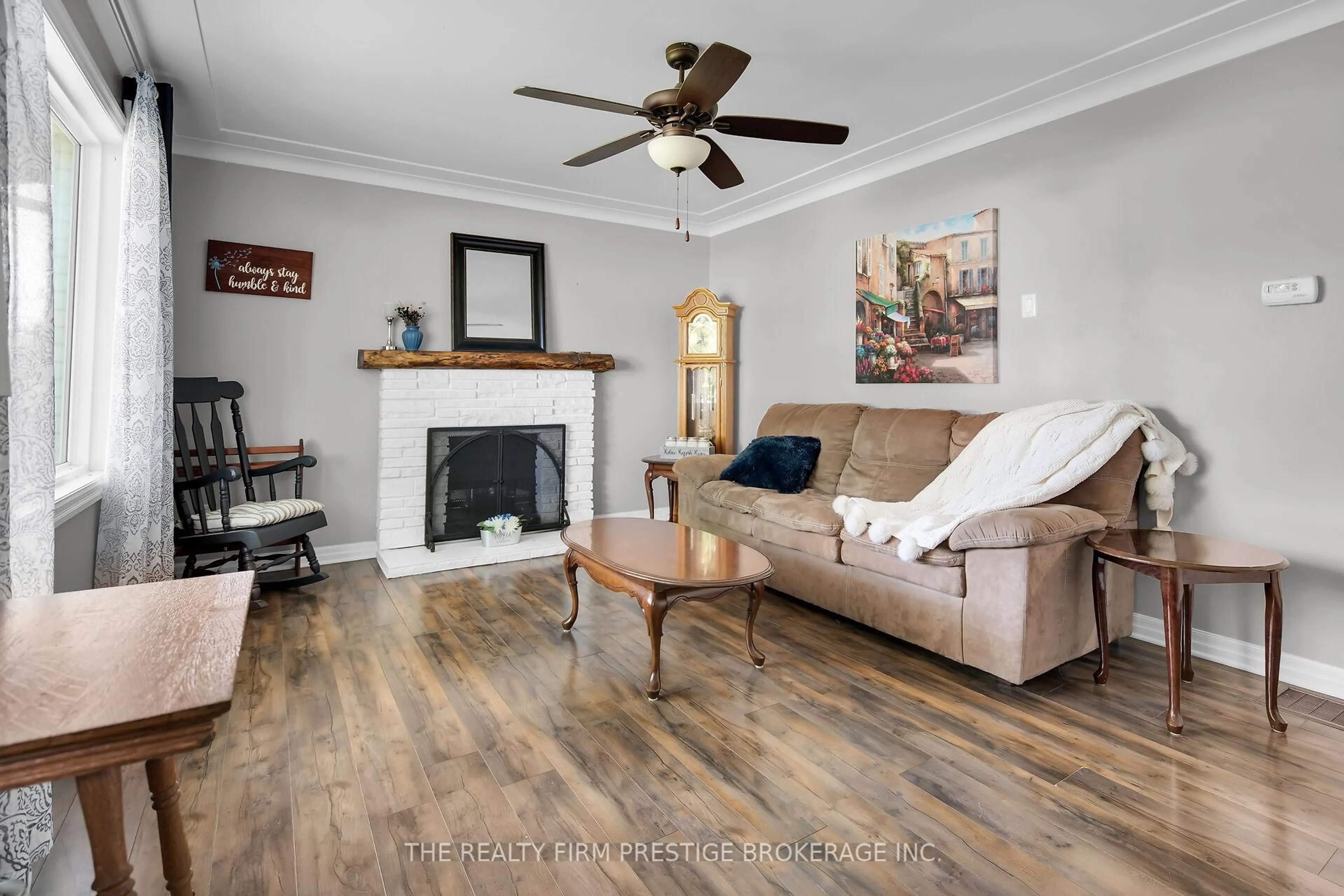 Living room with furniture, wood/laminate floor for 204 Main St, West Elgin Ontario N0L 2P0