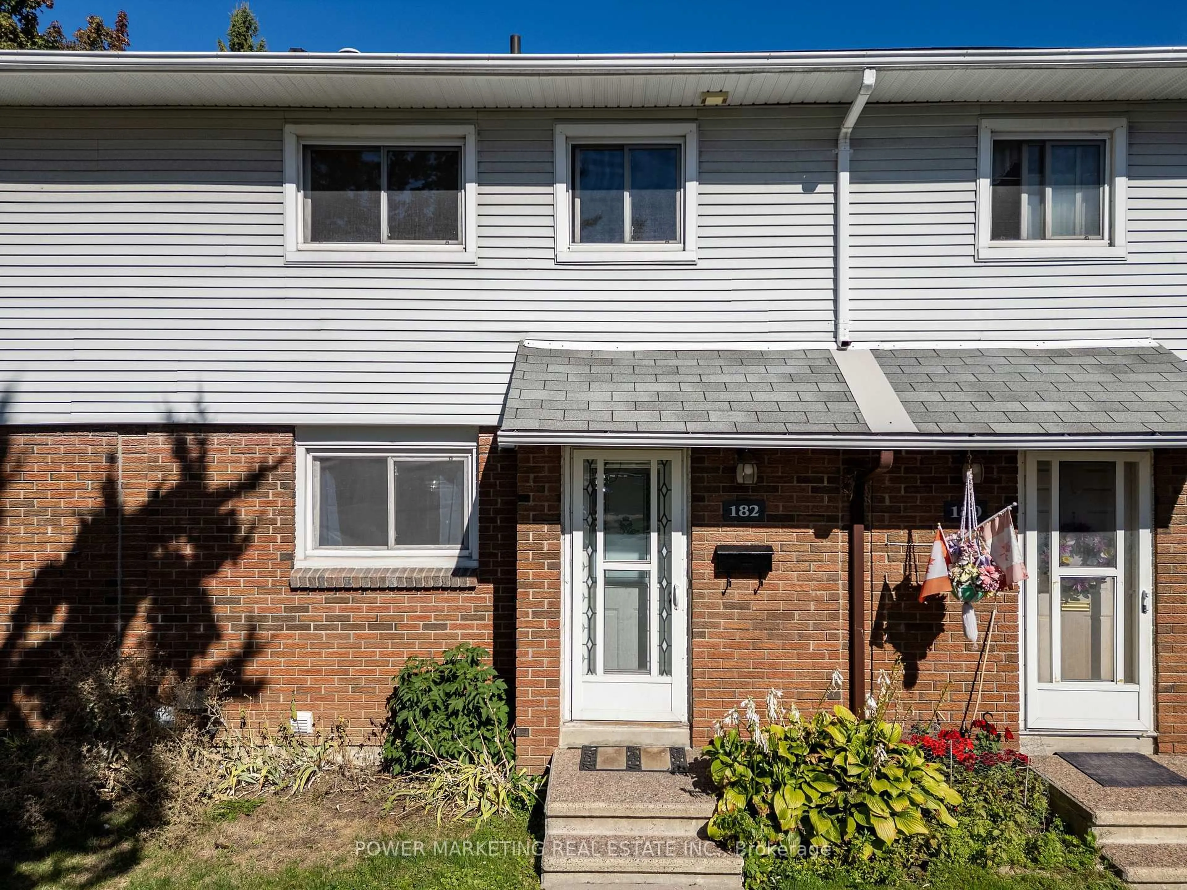 Home with vinyl exterior material, street for 1045 MORRISON Dr #182, Ottawa Ontario K2H 7L2