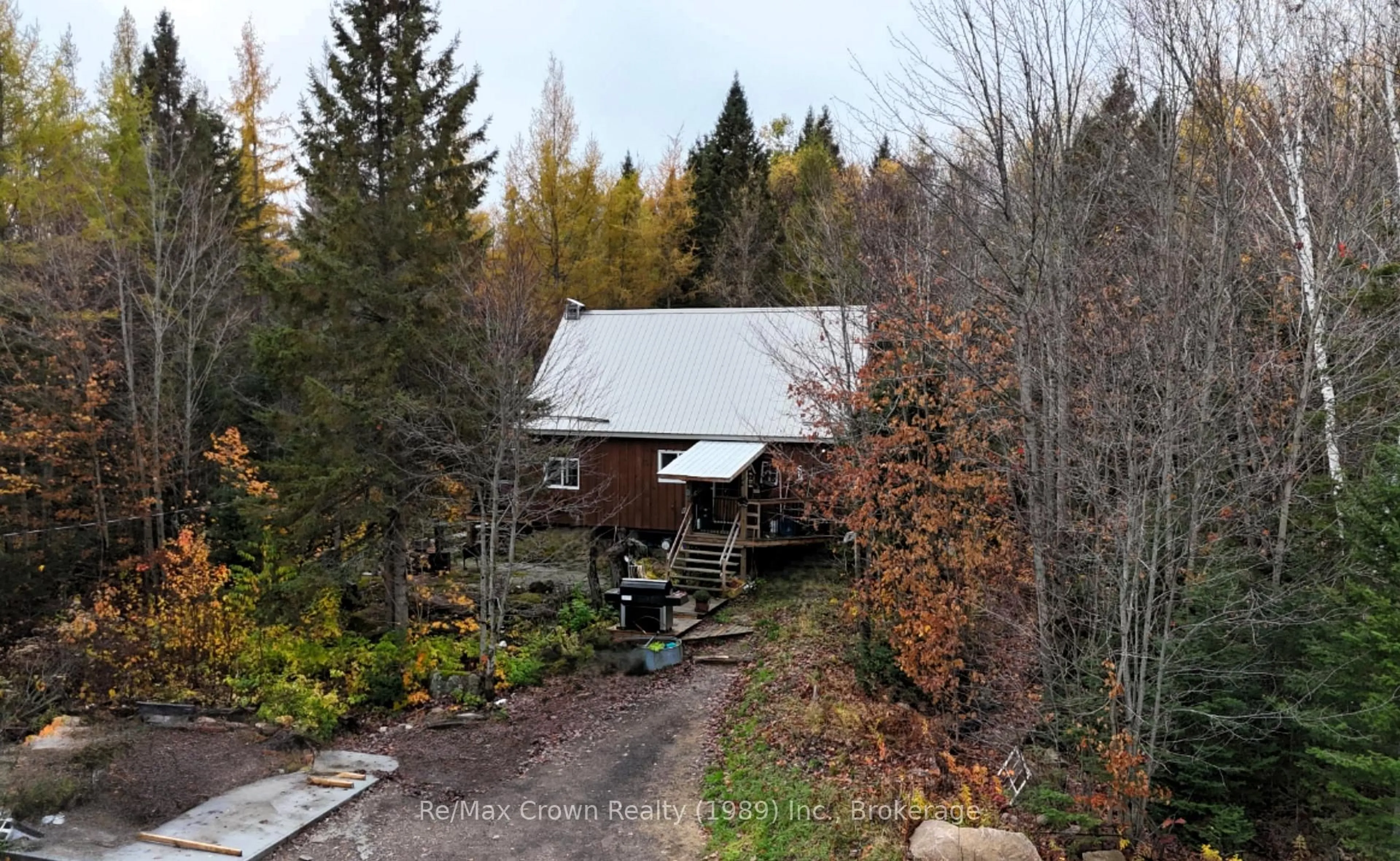A pic from outside/outdoor area/front of a property/back of a property/a pic from drone, forest/trees view for 575 Muskoka Rd, Strong Ontario P0A 1Z0