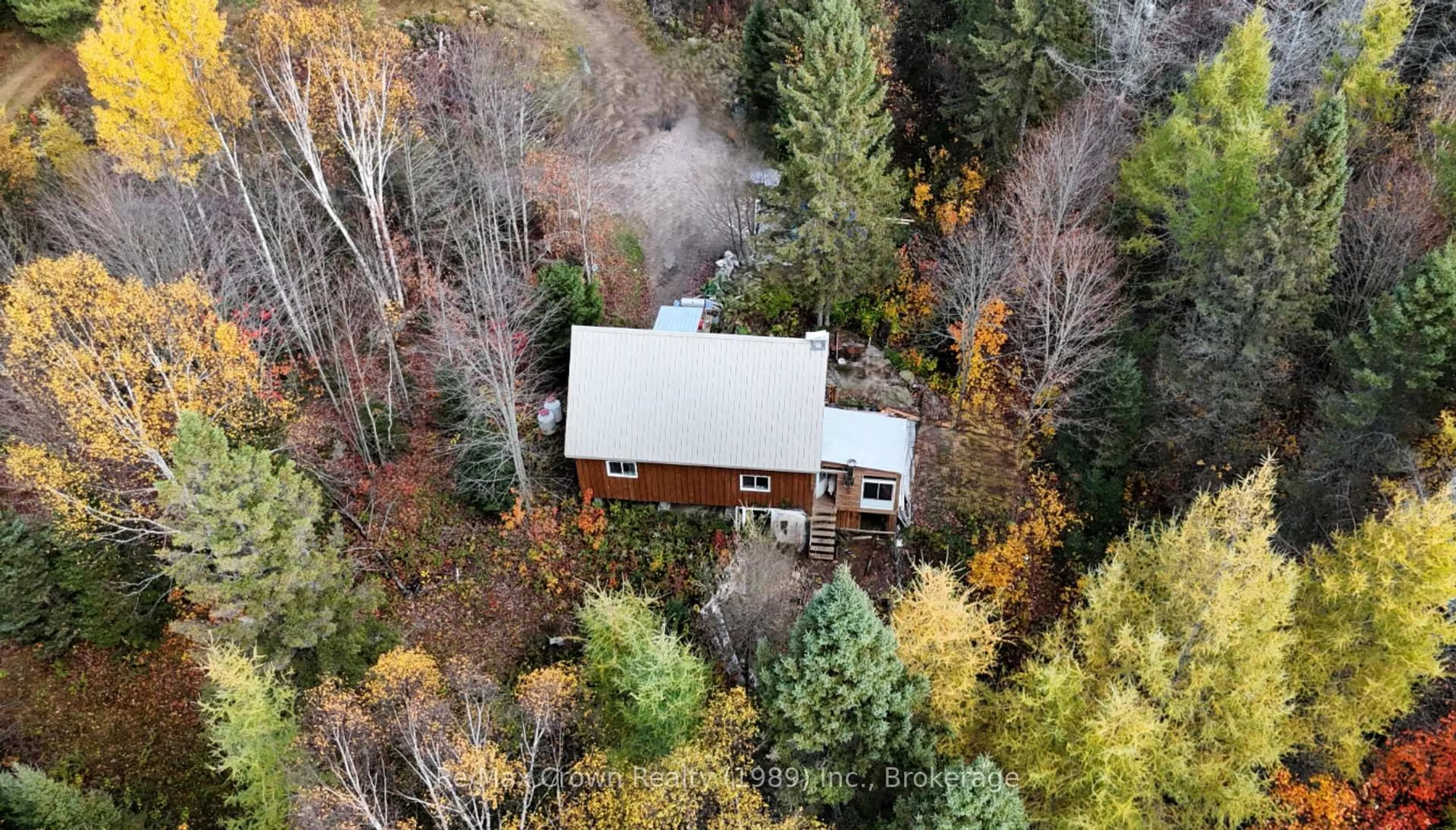 A pic from outside/outdoor area/front of a property/back of a property/a pic from drone, forest/trees view for 575 Muskoka Rd, Strong Ontario P0A 1Z0