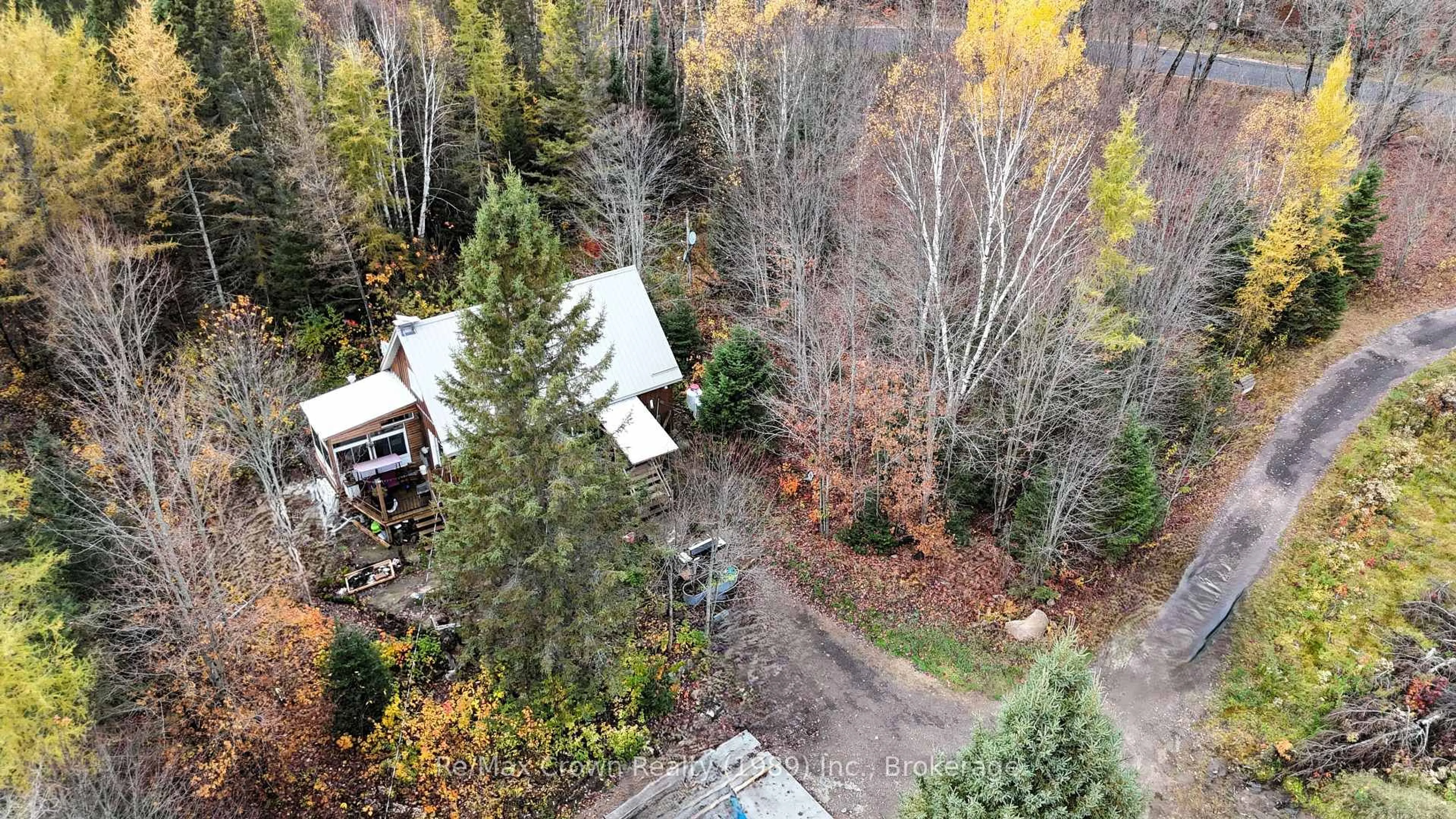 A pic from outside/outdoor area/front of a property/back of a property/a pic from drone, forest/trees view for 575 Muskoka Rd, Strong Ontario P0A 1Z0