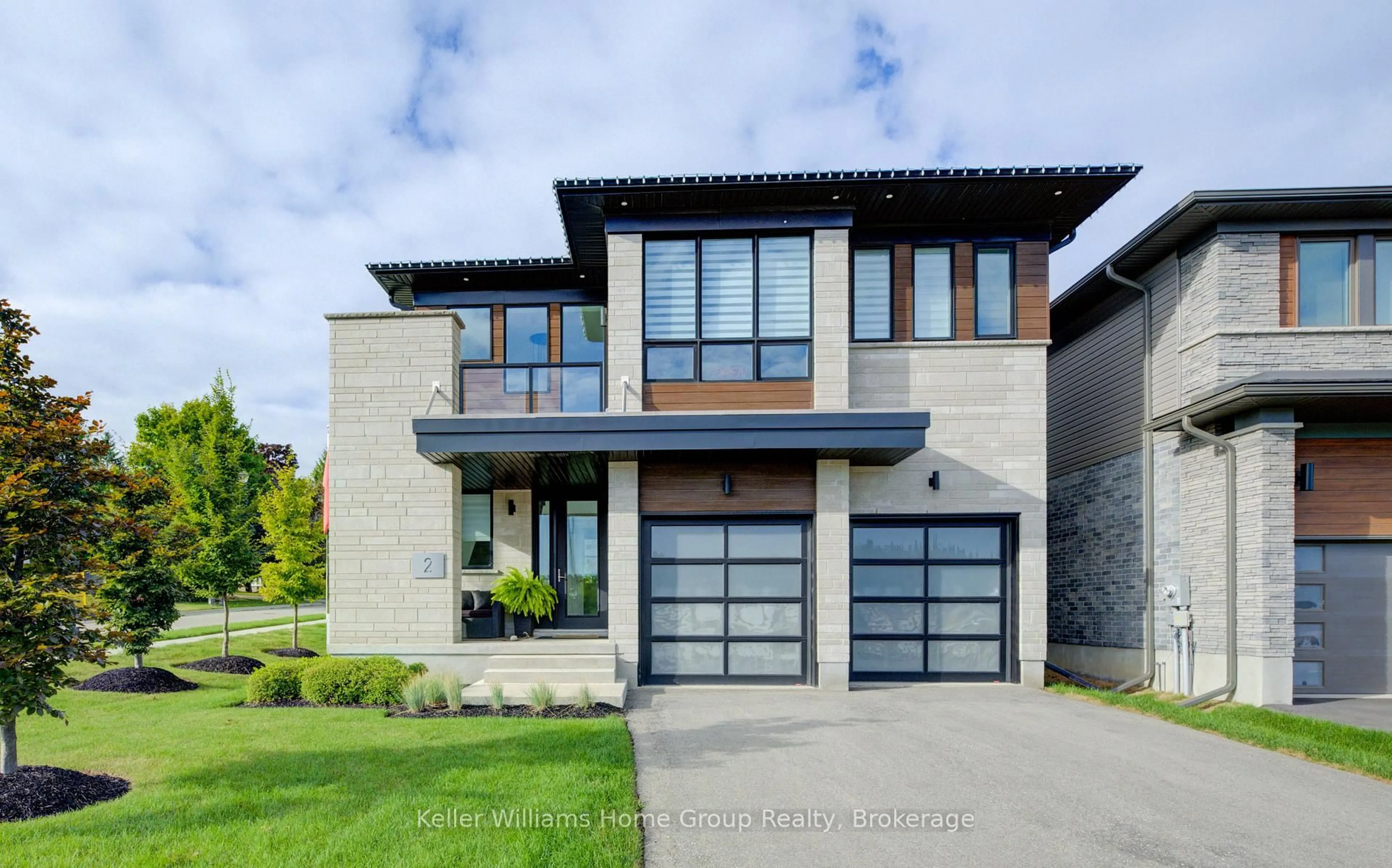 Home with brick exterior material, street for 2 Nicholas Way, Guelph Ontario N1E 0T1