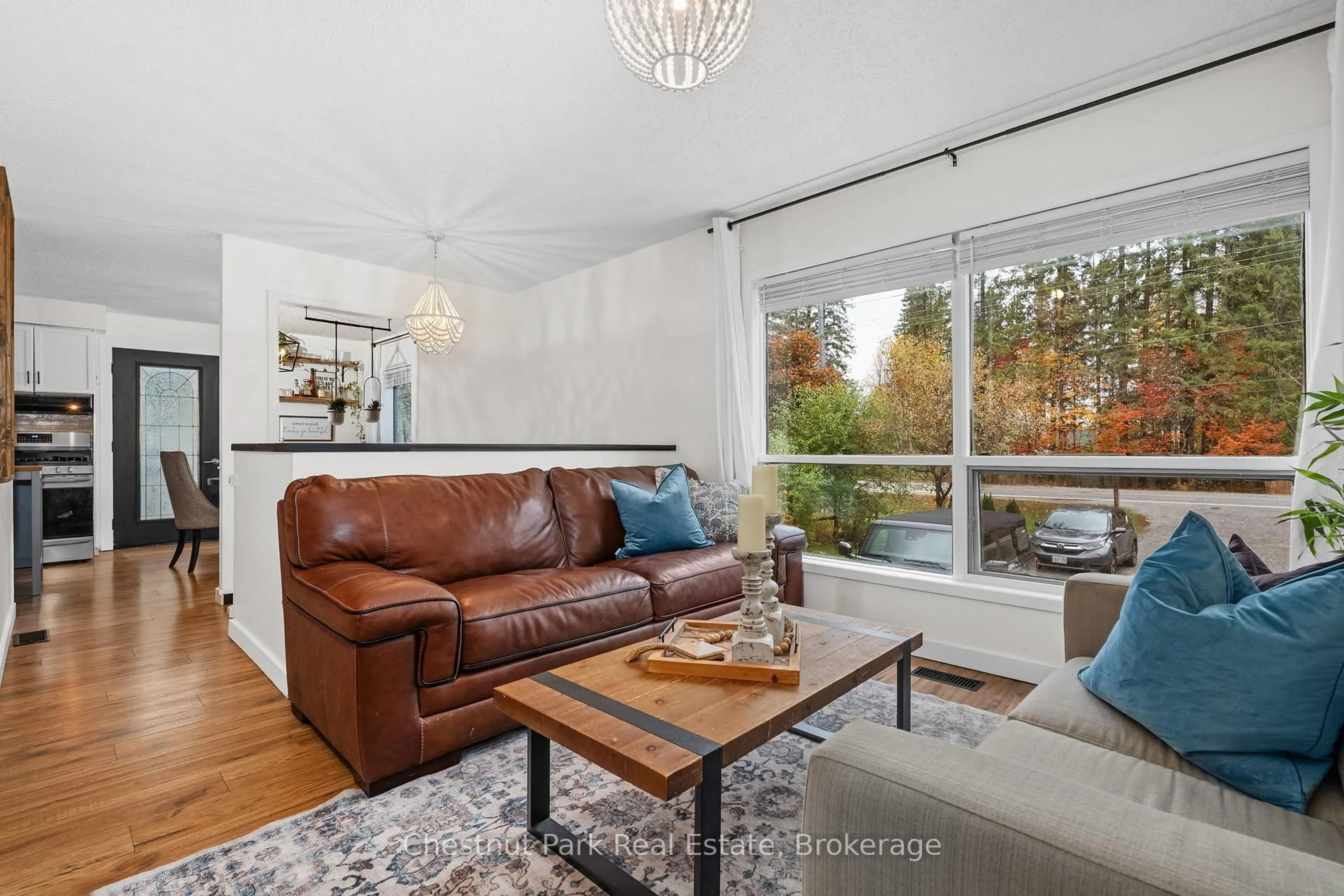 Living room with furniture, wood/laminate floor for 73 Hanes Rd, Huntsville Ontario P1H 1M3