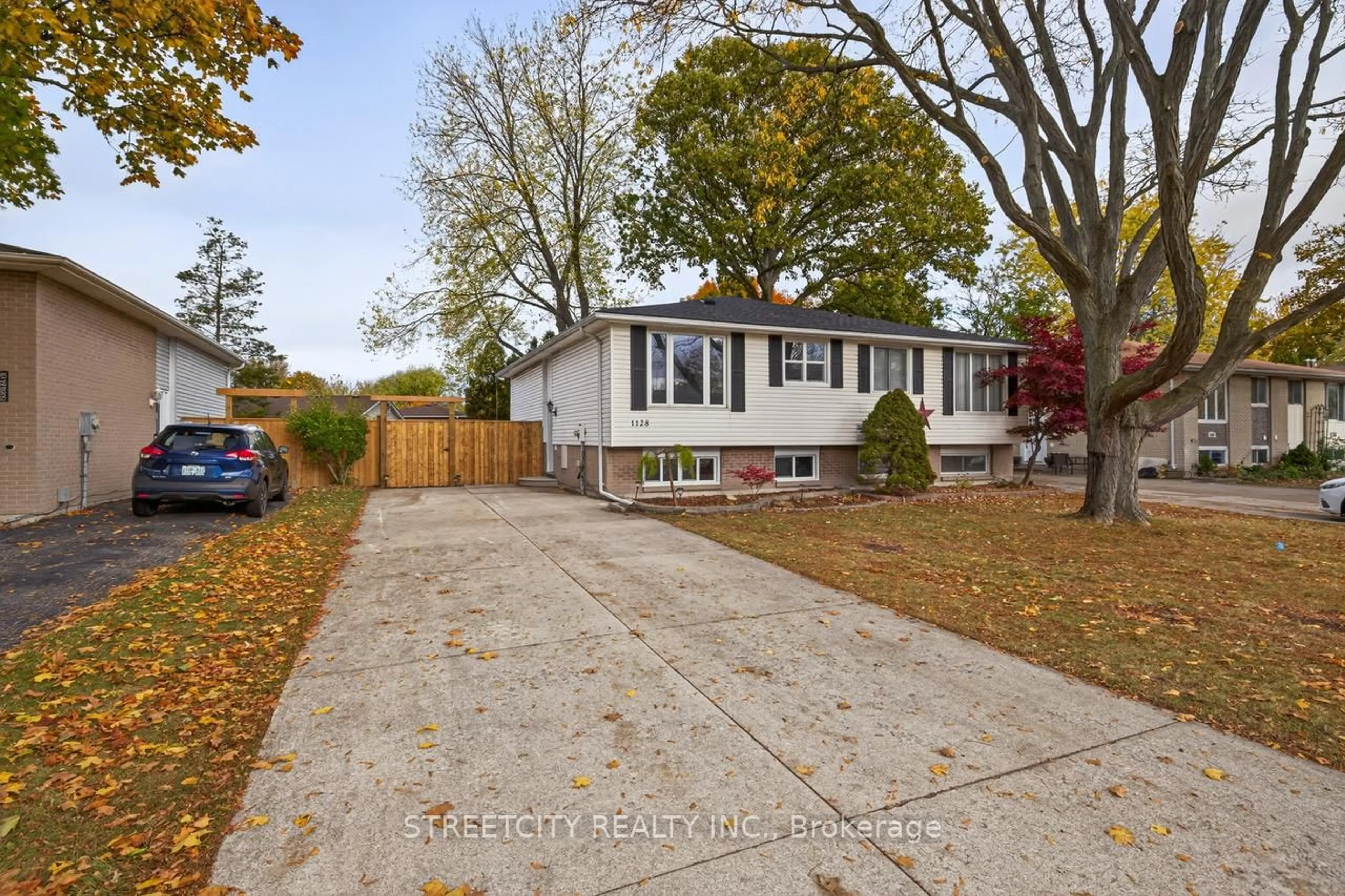 Home with vinyl exterior material, street for 1128 Overlea Cres, Sarnia Ontario N7S 4E4