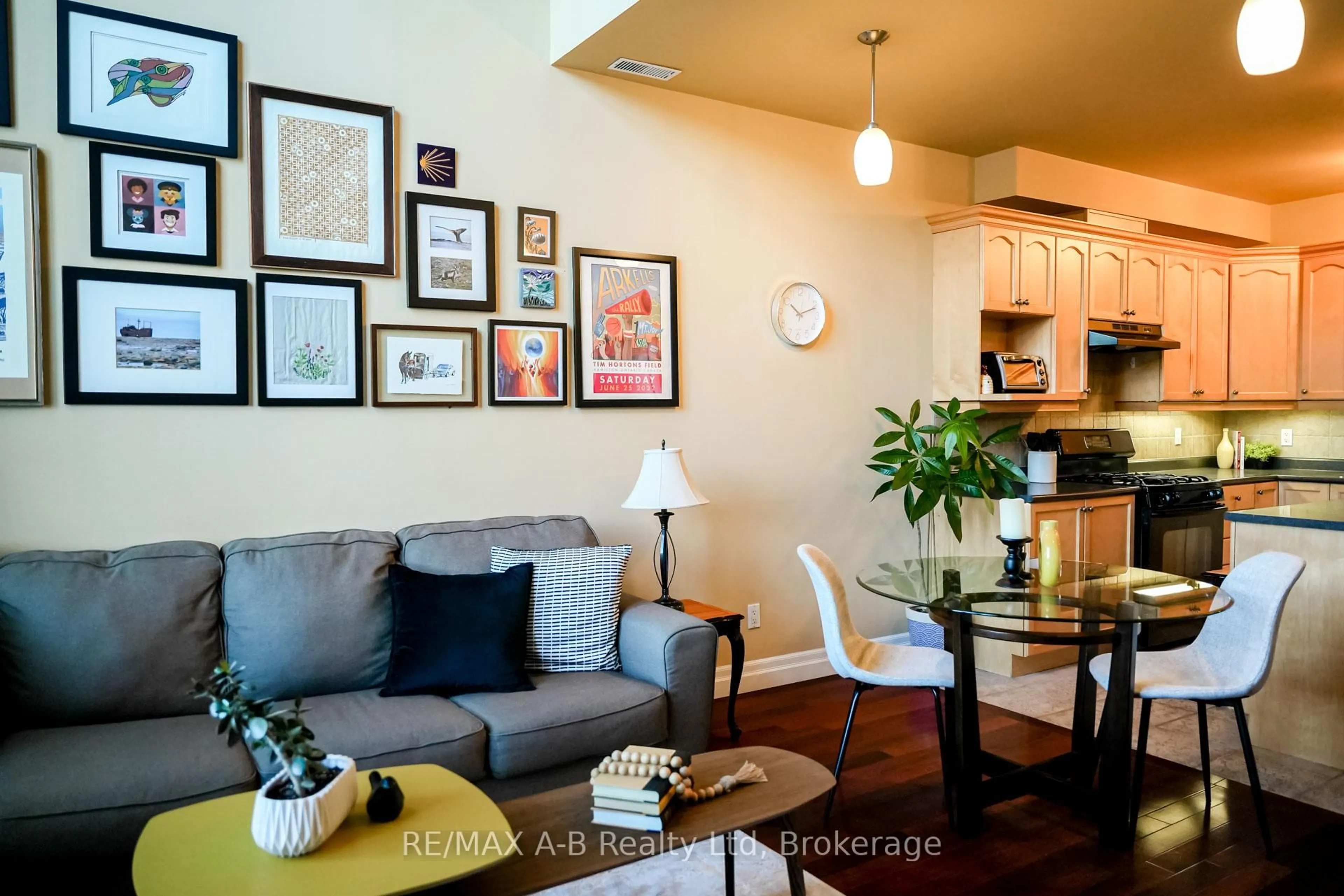 Living room with furniture, wood/laminate floor for 555 King St #305, Kitchener Ontario N2G 2L9