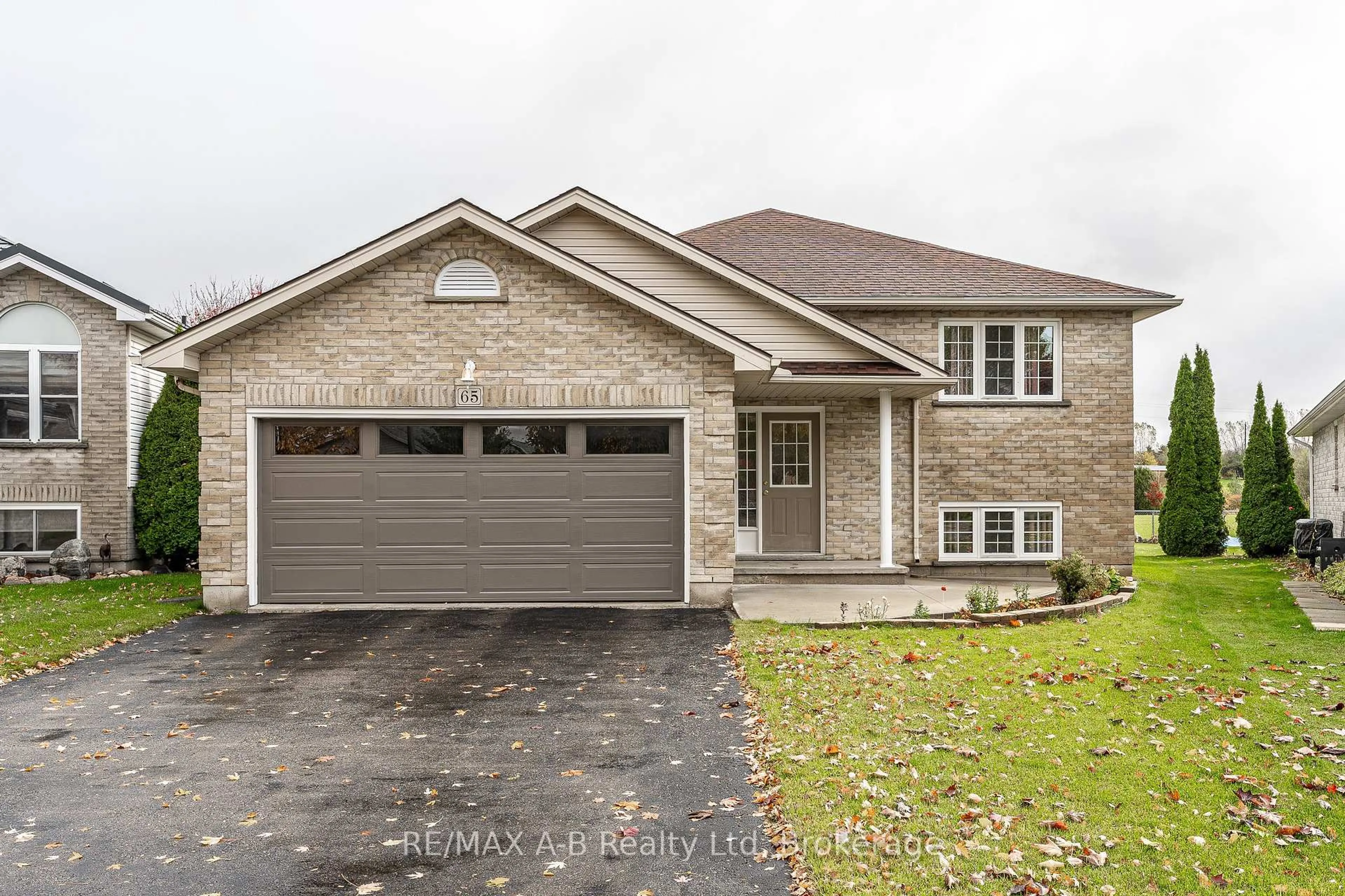 Home with brick exterior material, street for 65 Parkhaven Cres, St. Marys Ontario N4X 1E7