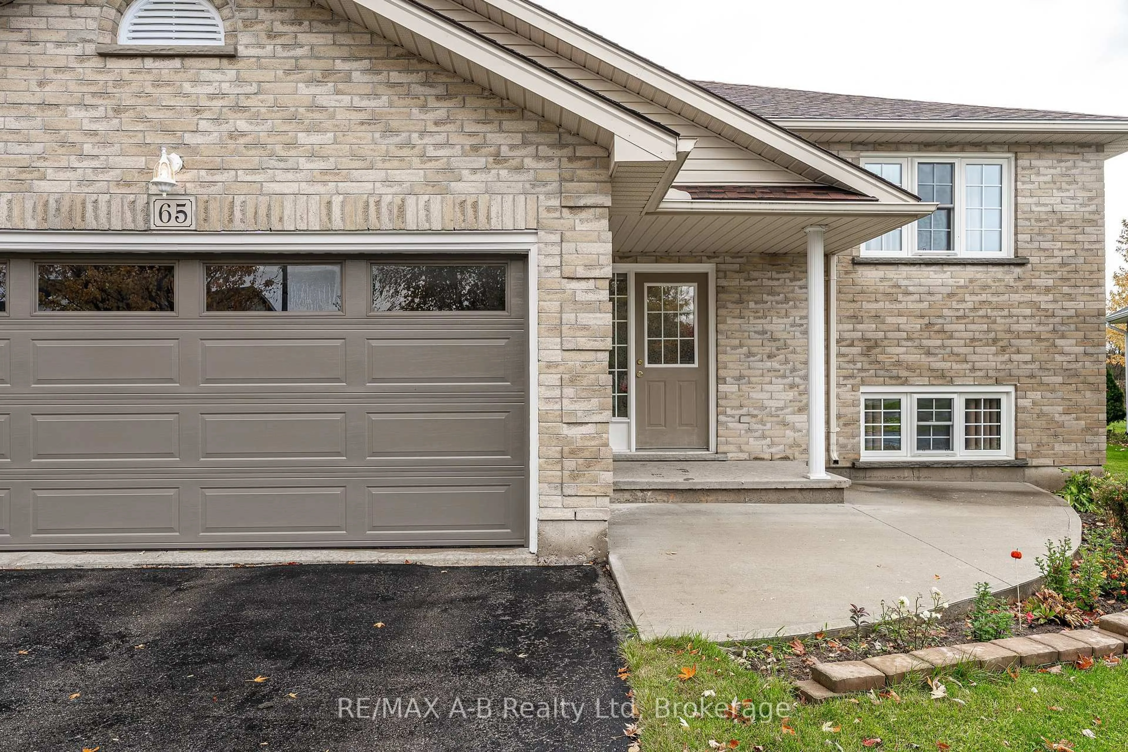 Home with brick exterior material, street for 65 Parkhaven Cres, St. Marys Ontario N4X 1E7