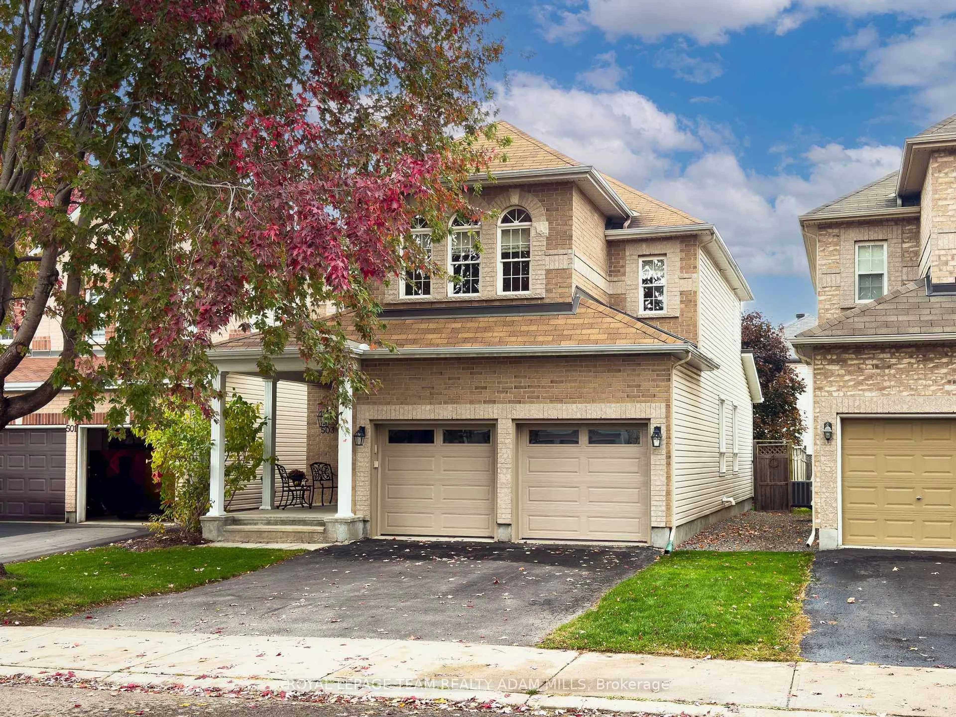 Home with vinyl exterior material, street for 503 Stonechurch Way, Ottawa Ontario K2J 0C5