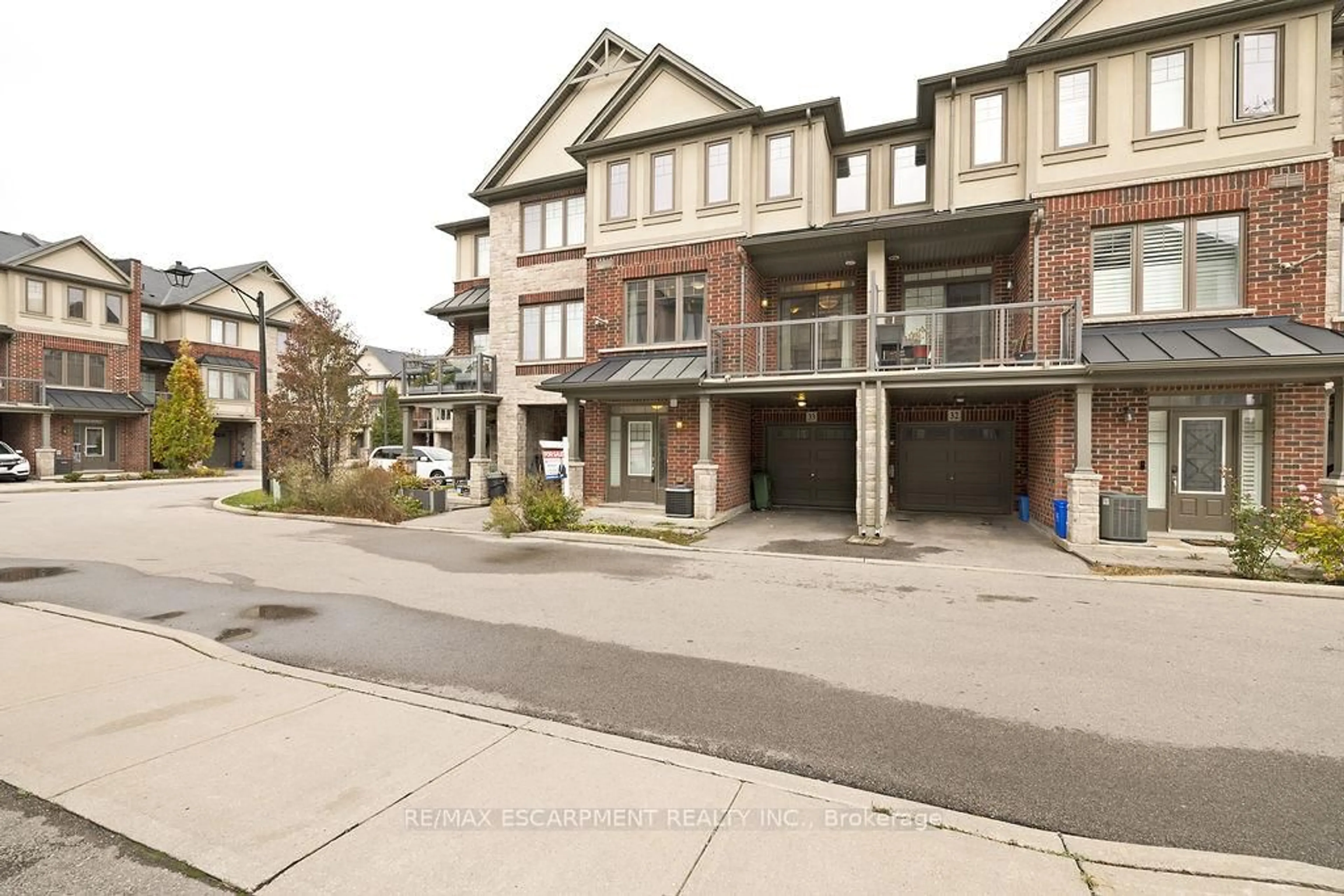 A pic from outside/outdoor area/front of a property/back of a property/a pic from drone, street for 1169 Garner Rd #33, Hamilton Ontario L9G 0G8