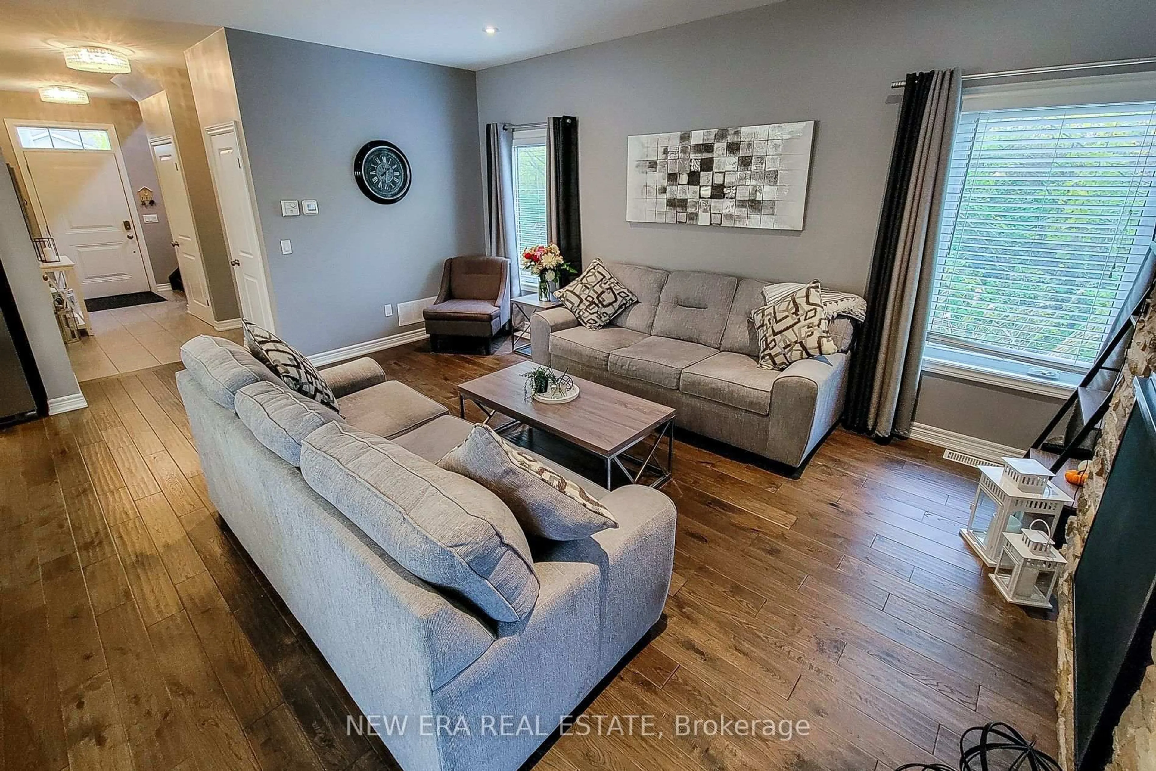 Living room with furniture, wood/laminate floor for 4274 Sixth Ave, Niagara Falls Ontario L2E 4S8