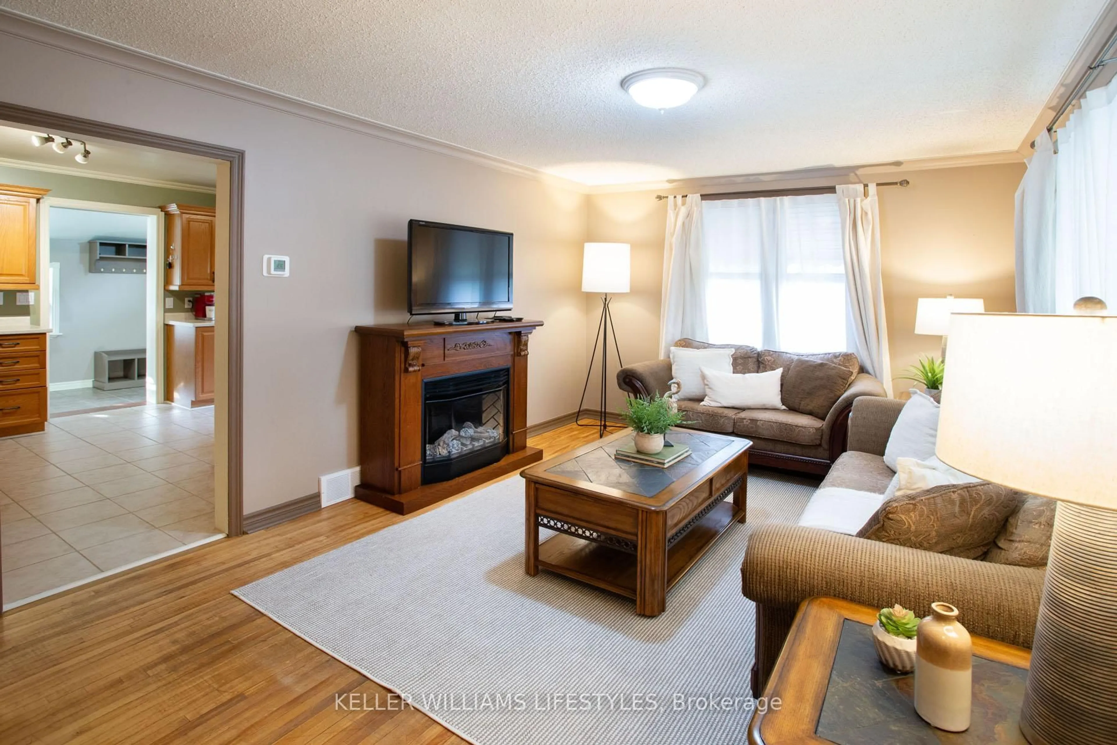 Living room with furniture, wood/laminate floor for 315 Fairview Ave, London South Ontario N6C 4V1
