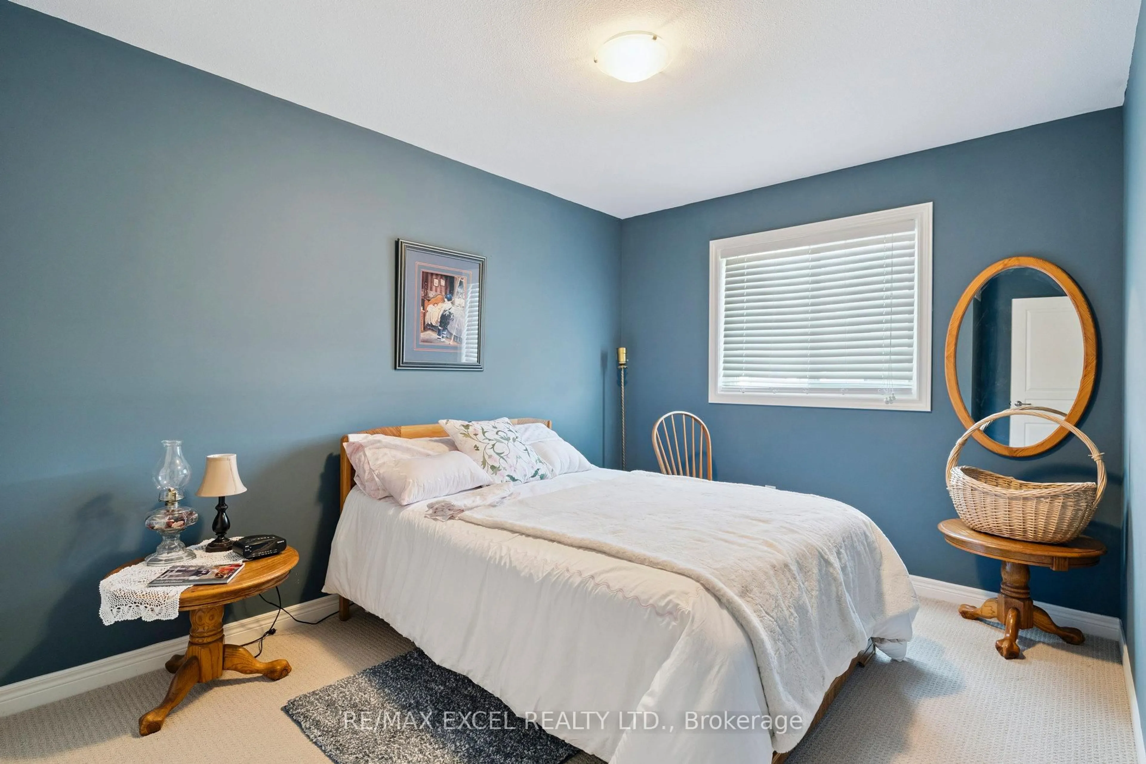 Bedroom with bed, wood/laminate floor for 6401 Shapton Cres, Niagara Falls Ontario L2H 0L8