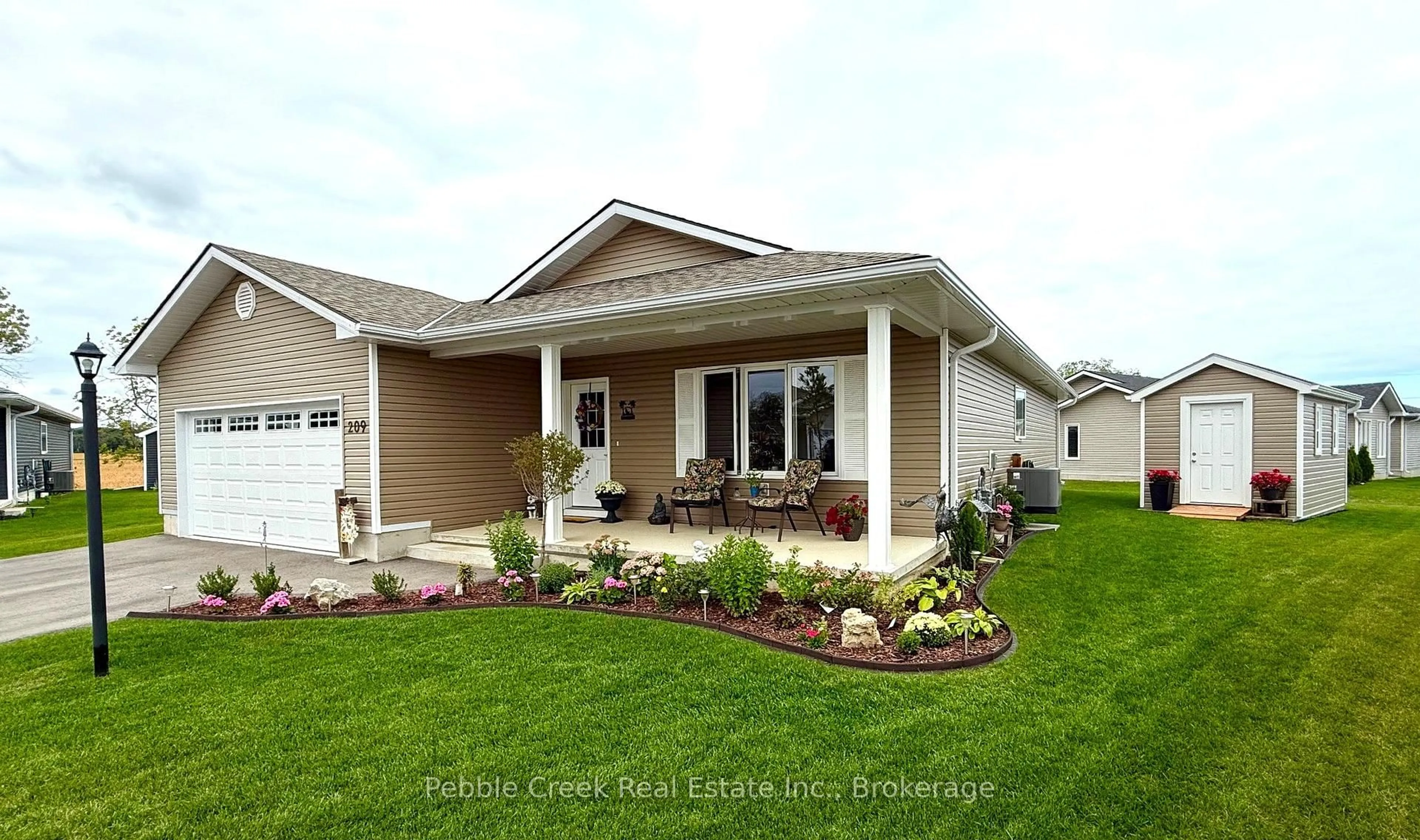 Home with vinyl exterior material, street for 209 Lake Breeze Dr, Ashfield-Colborne-Wawanosh Ontario N7A 0C6