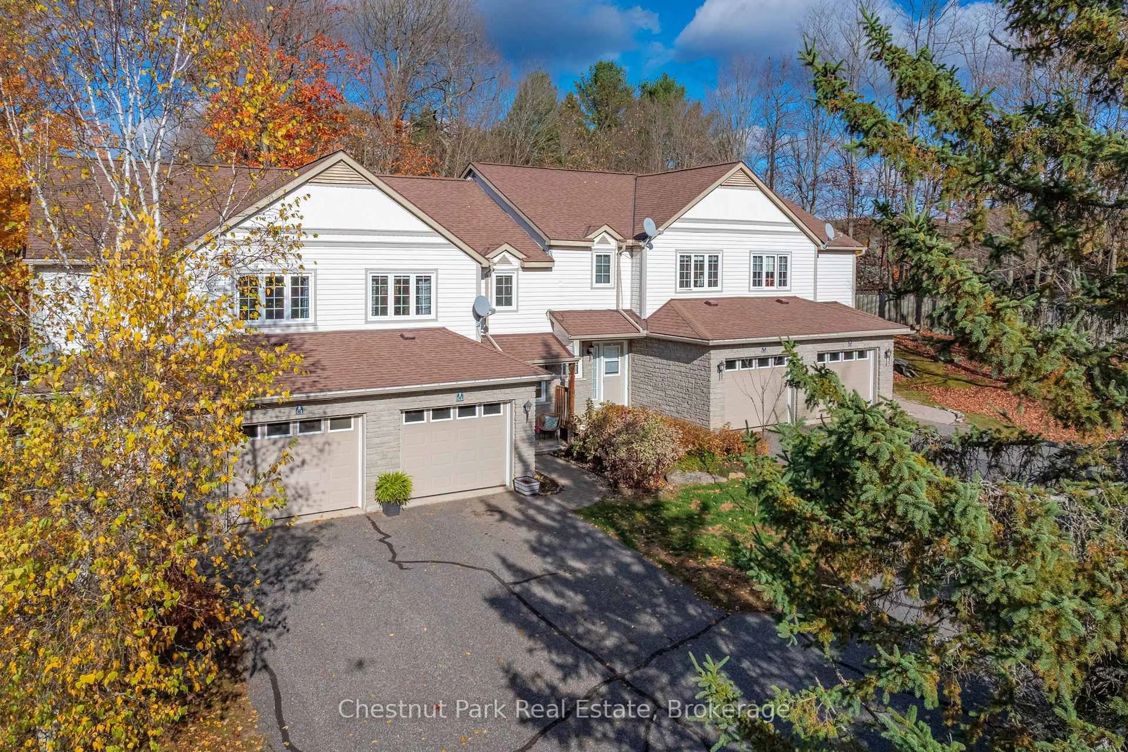 A pic from outside/outdoor area/front of a property/back of a property/a pic from drone, street for 20 Dairy Lane #C2, Huntsville Ontario P1H 2L1
