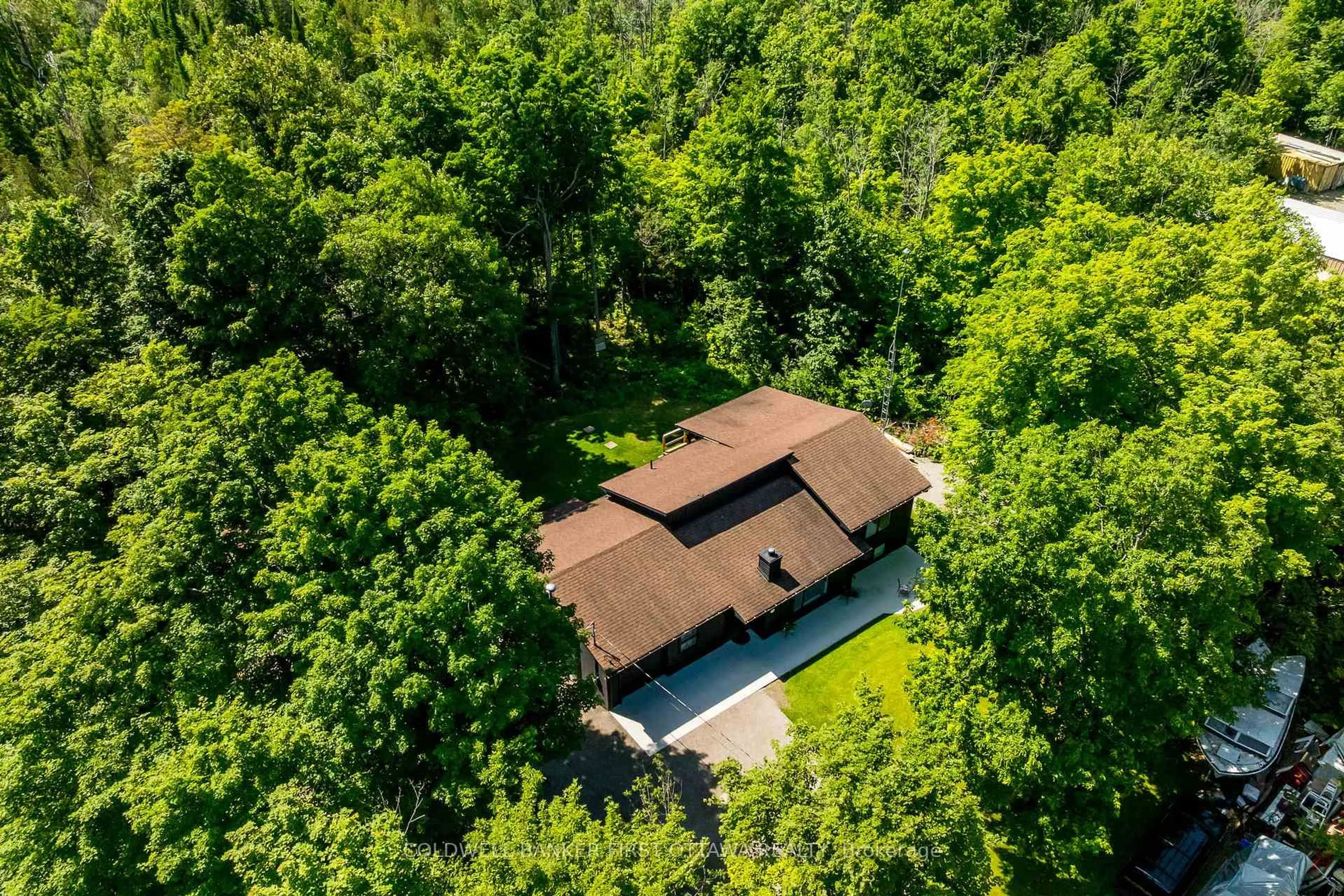 A pic from outside/outdoor area/front of a property/back of a property/a pic from drone, forest/trees view for 6779 Roger Stevens Dr, Smiths Falls Ontario K7A 4S6