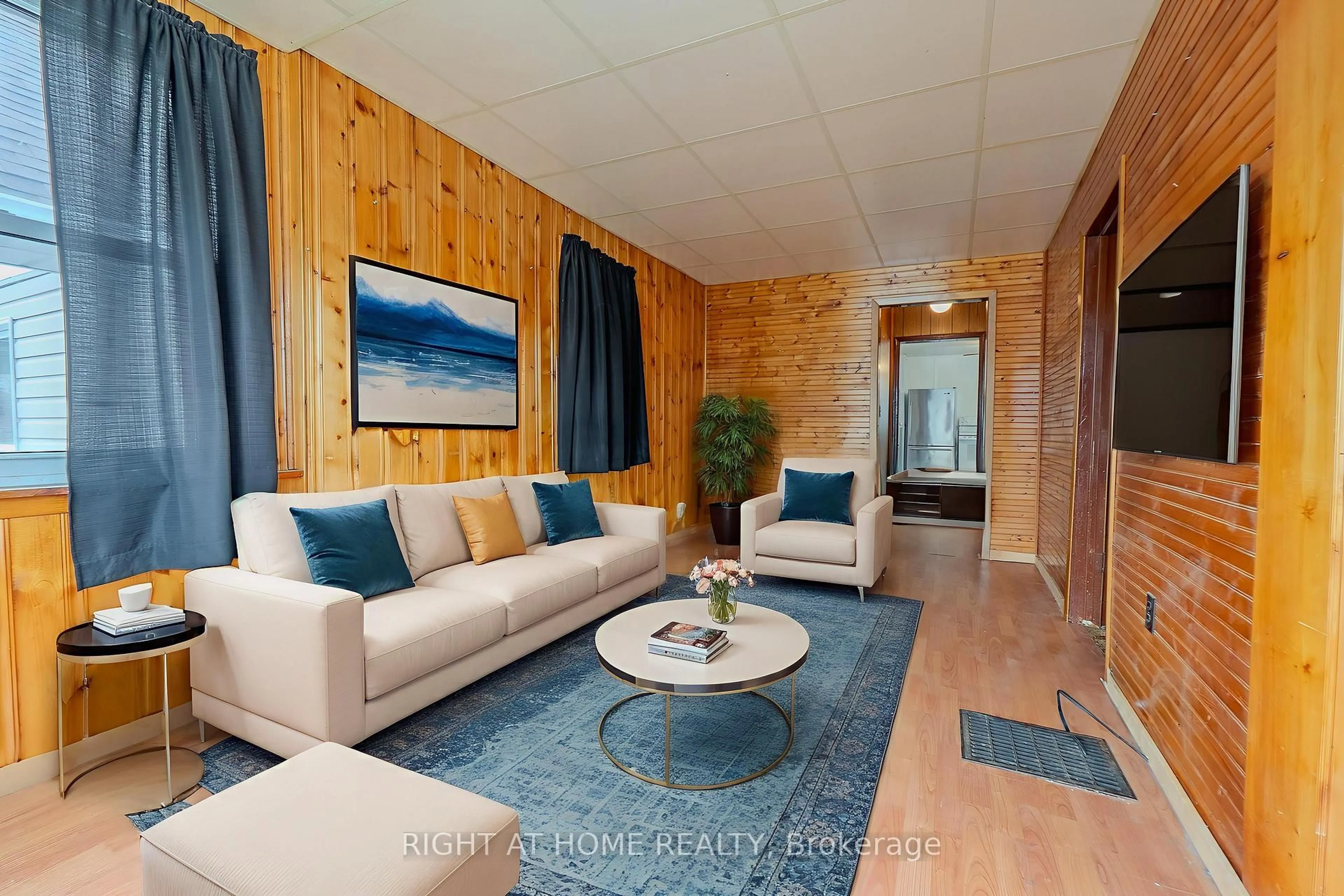 Living room with furniture, wood/laminate floor for 169 Princess St, North Bay Ontario P1B 1P8