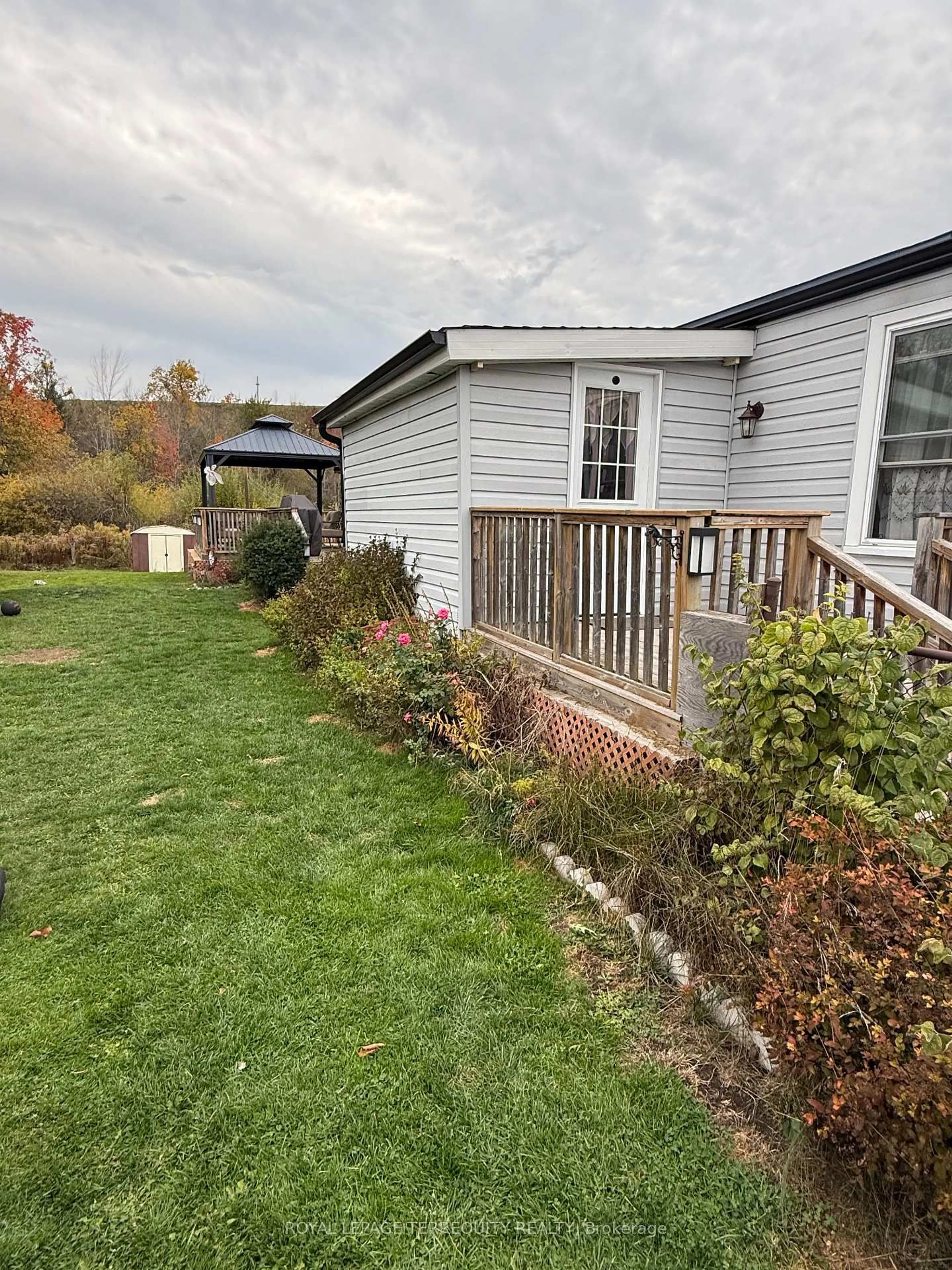 A pic from outside/outdoor area/front of a property/back of a property/a pic from drone, unknown for 2244 Heritage Line #72B, Otonabee-South Monaghan Ontario K9J 6X8