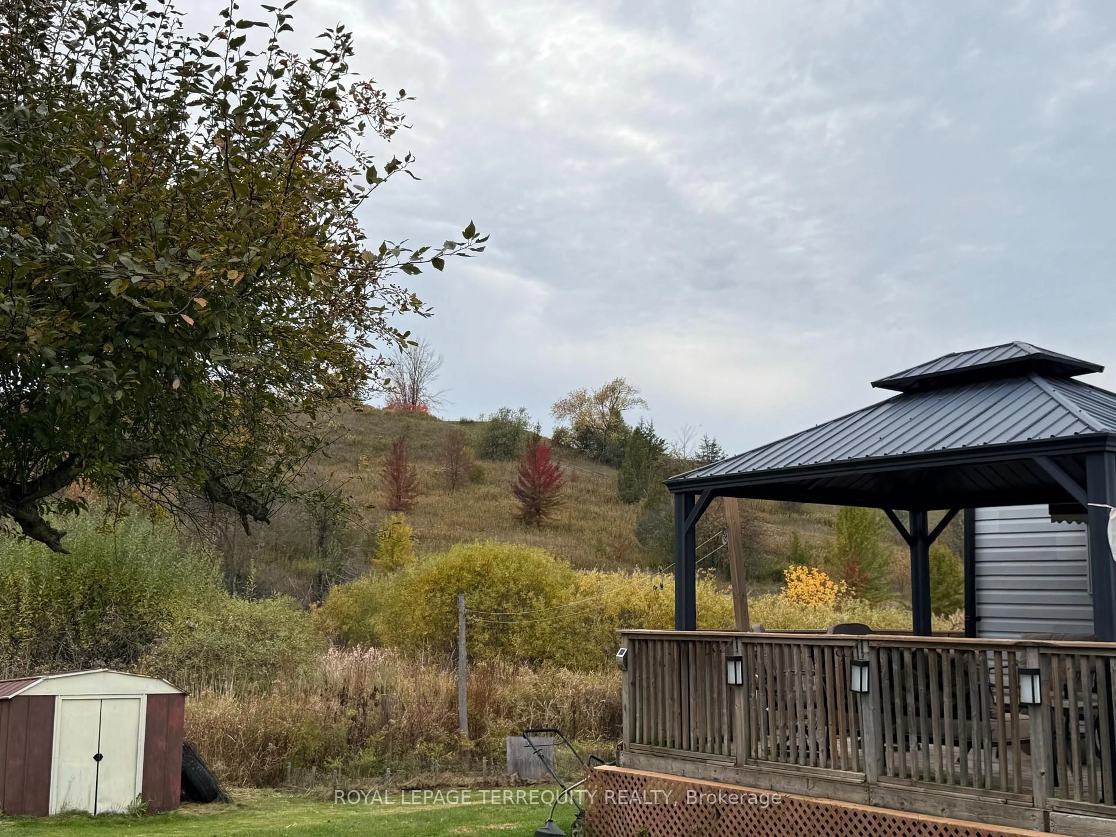 A pic from outside/outdoor area/front of a property/back of a property/a pic from drone, forest/trees view for 2244 Heritage Line #72B, Otonabee-South Monaghan Ontario K9J 6X8