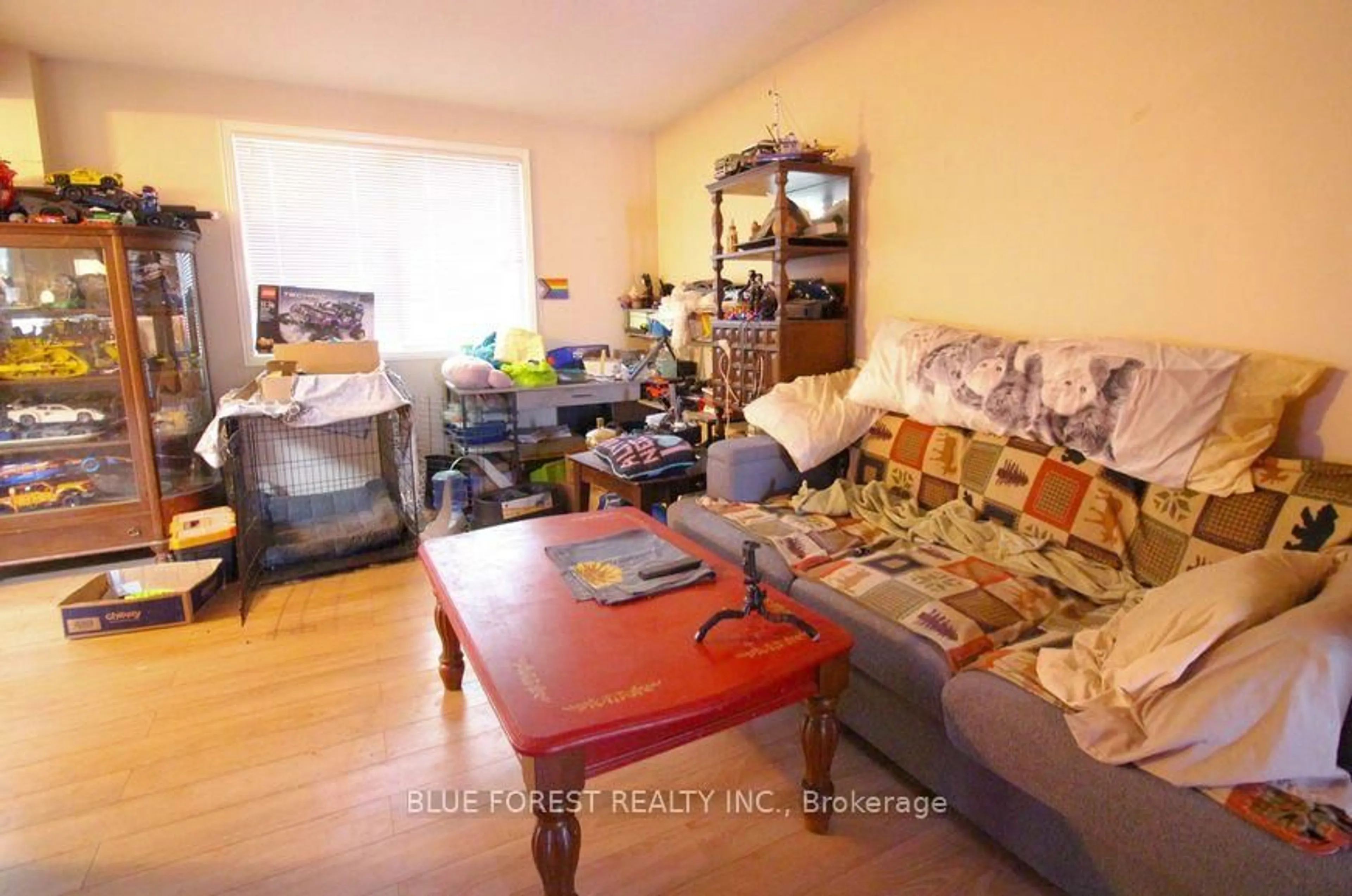 Living room with furniture, wood/laminate floor for 2039 Aldersbrook Rd, London North Ontario N6G 3N2