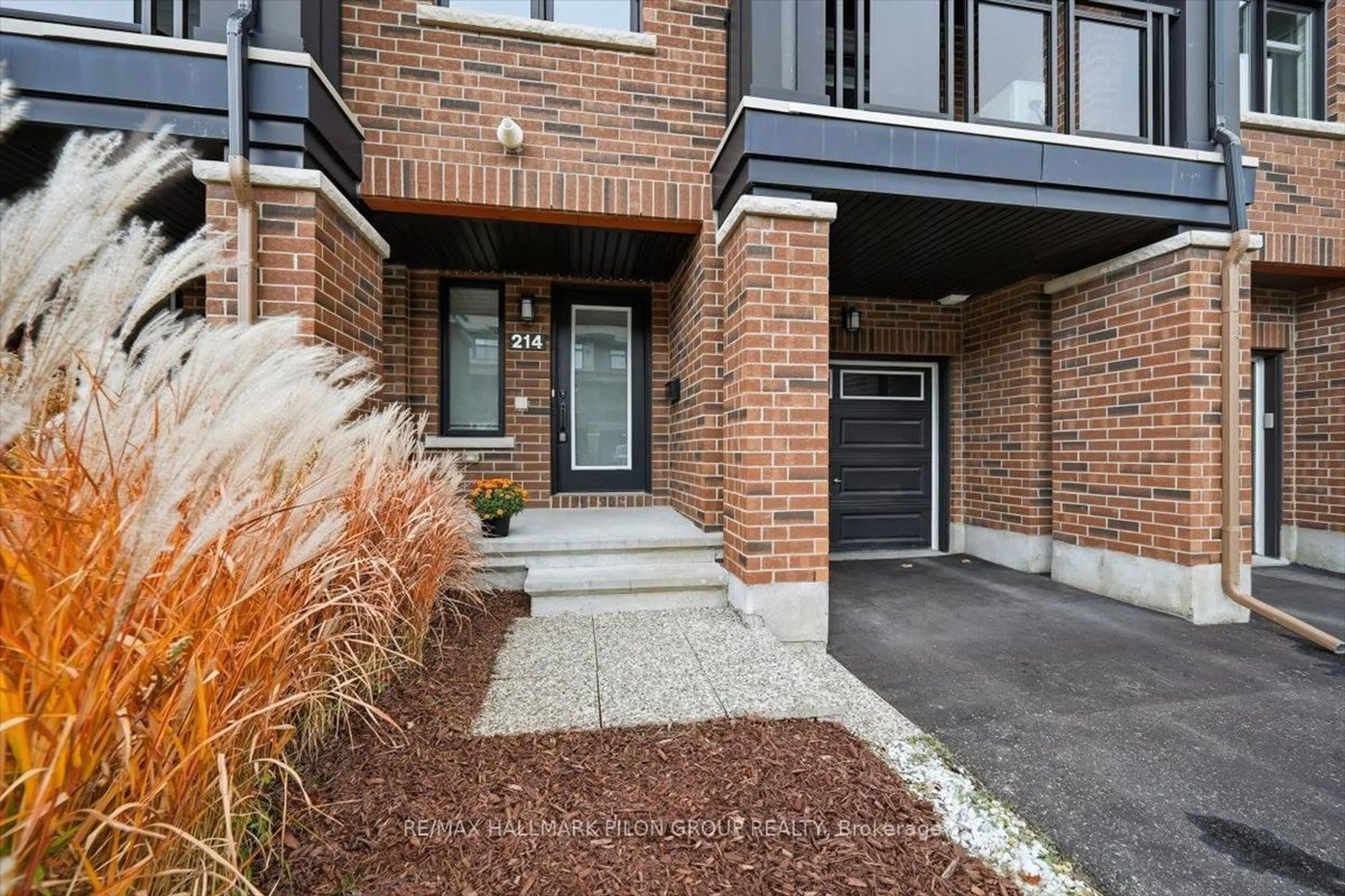 Home with brick exterior material, street for 214 Dragonfly Walk, Ottawa Ontario K1W 0J8