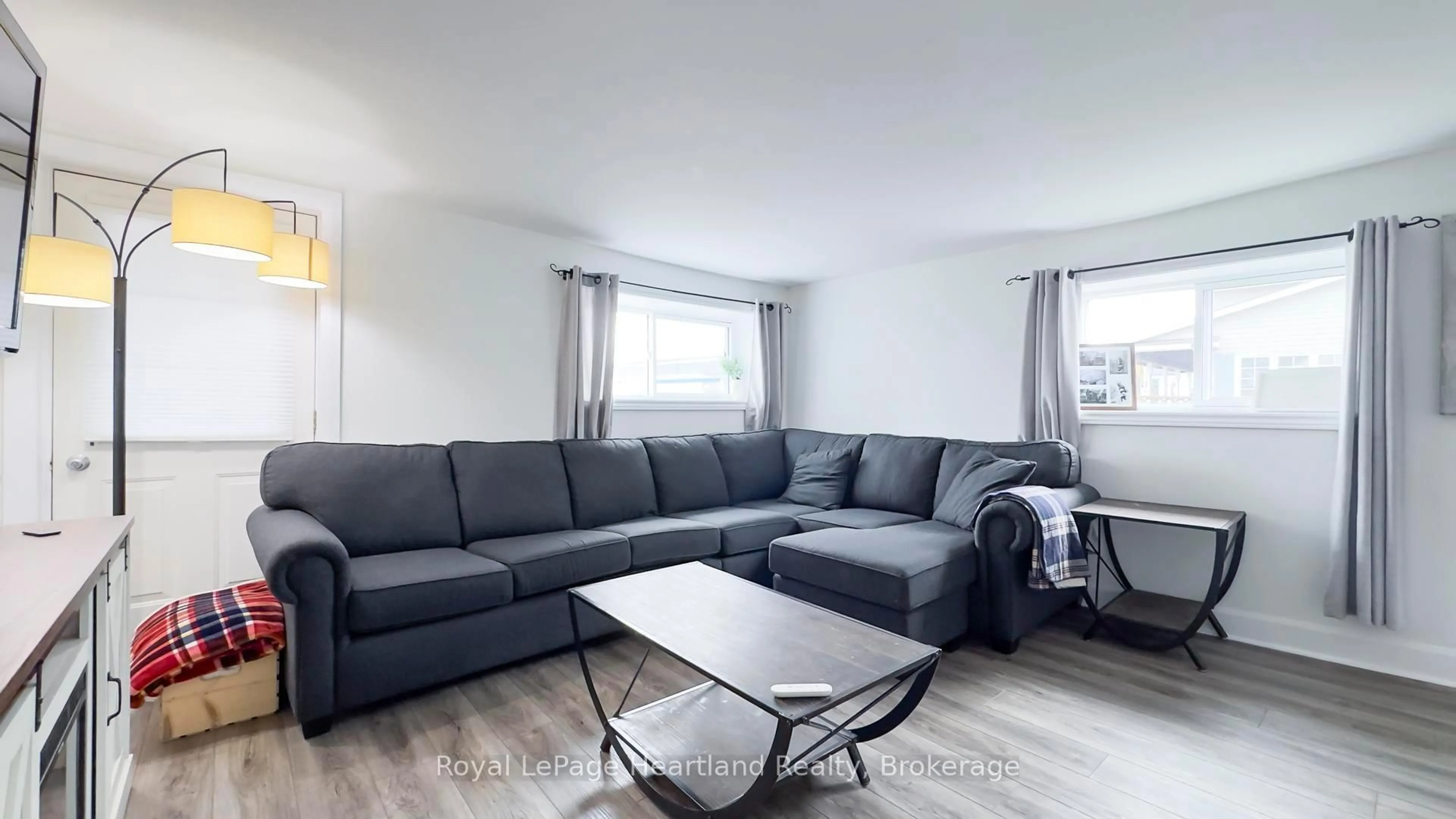Living room with furniture, wood/laminate floor for 252 Huron Rd, Goderich Ontario N7A 2Z9
