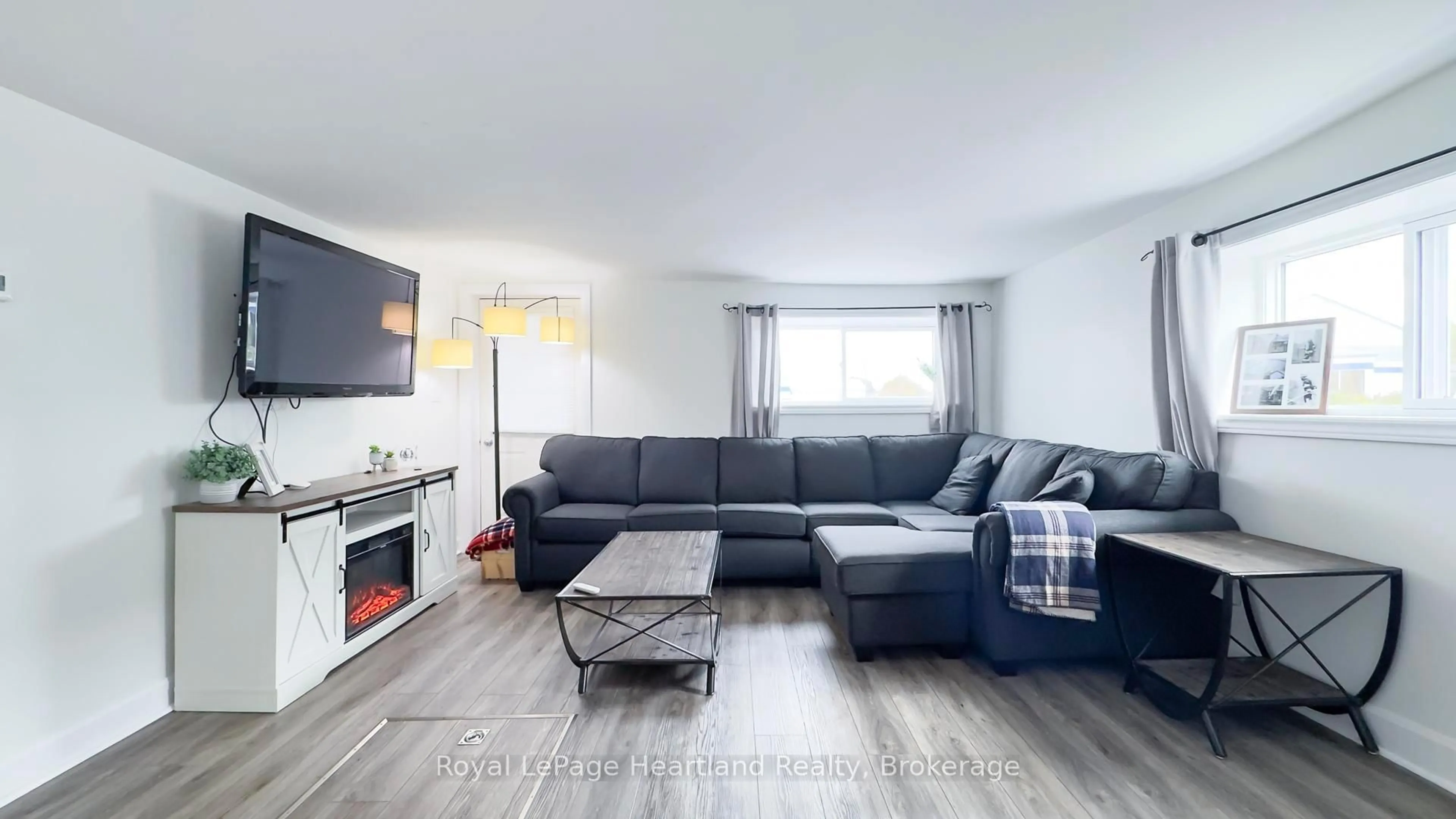 Living room with furniture, wood/laminate floor for 252 Huron Rd, Goderich Ontario N7A 2Z9