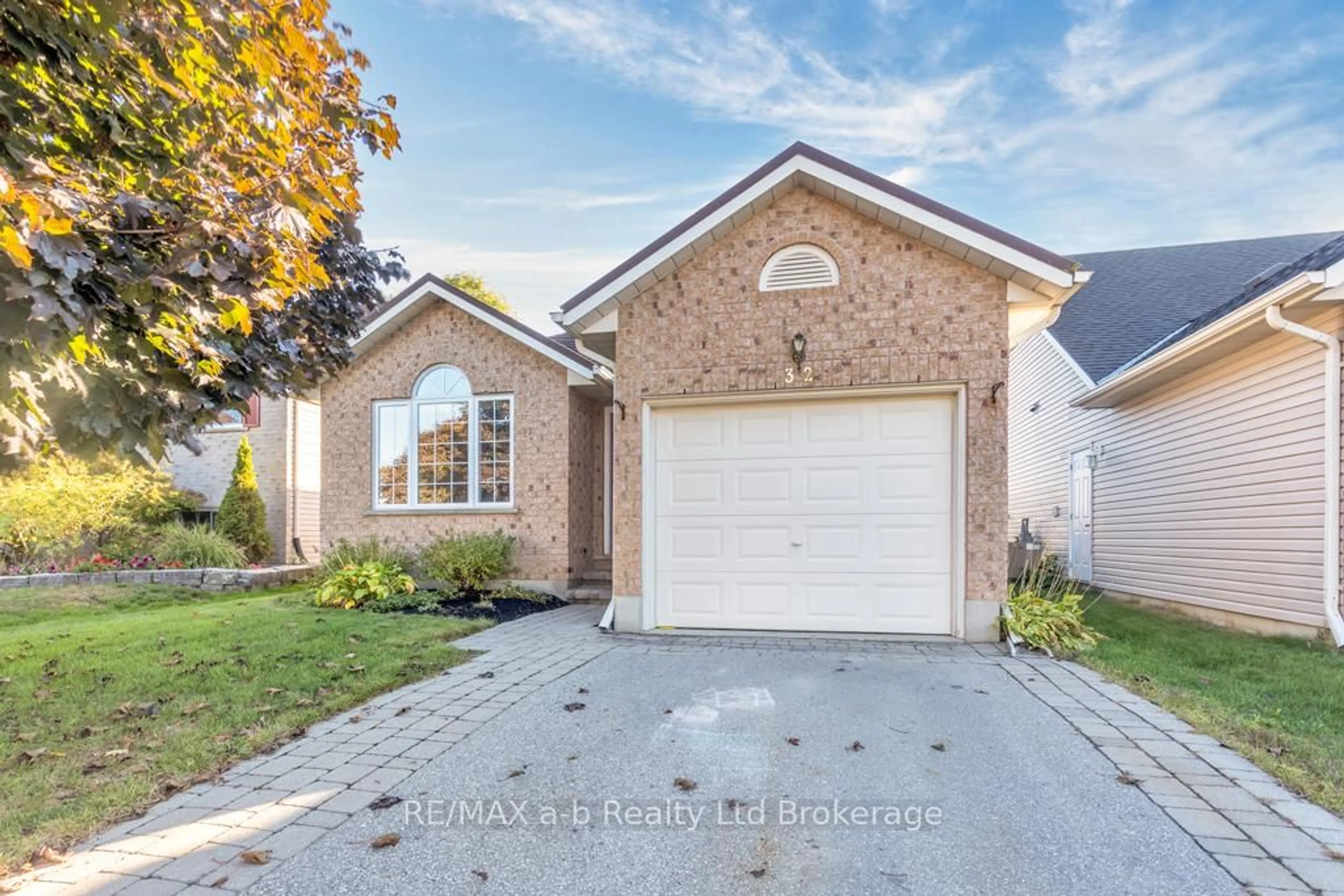 Home with brick exterior material, street for 32 Magnolia Dr, Tillsonburg Ontario N4G 5N9