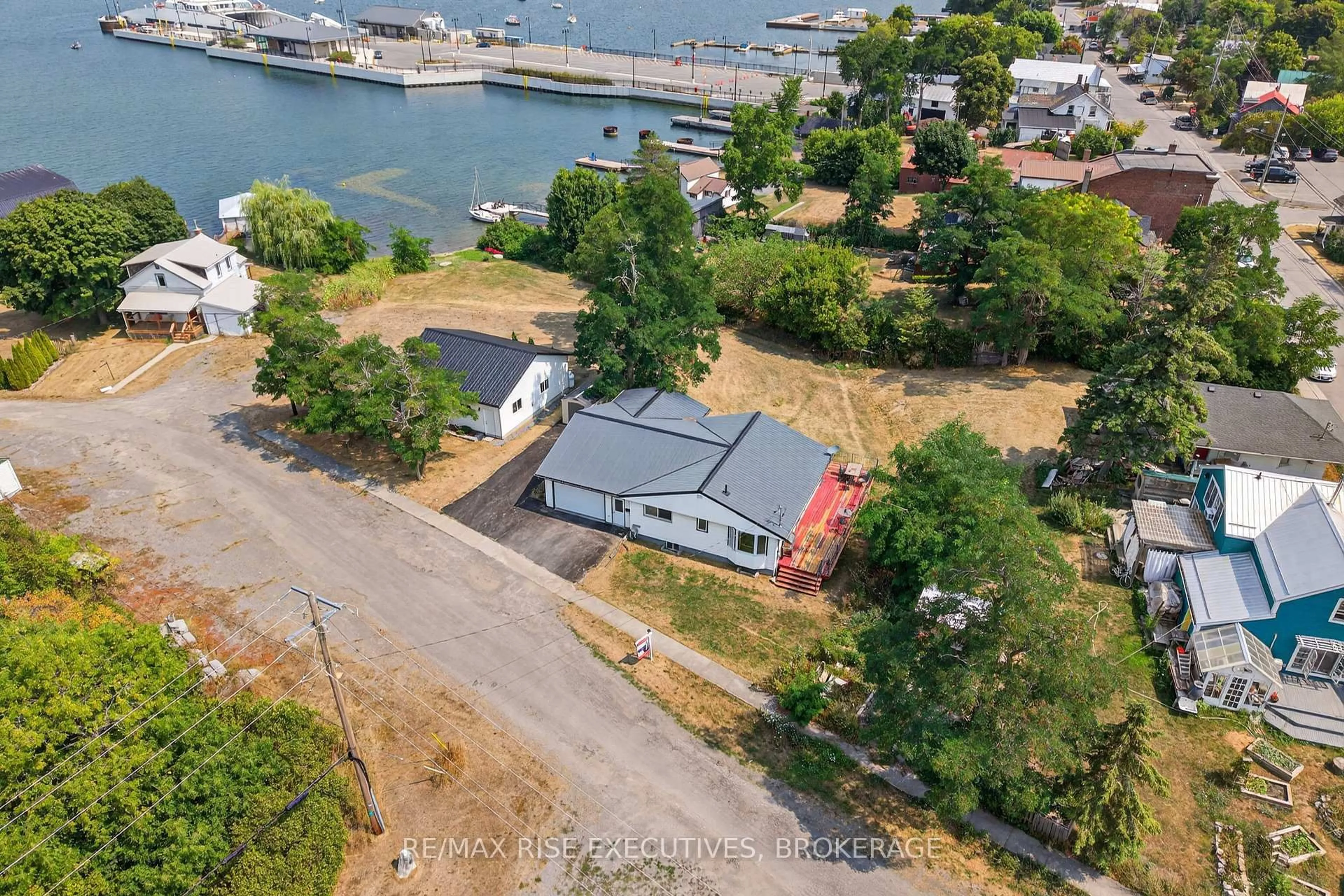 A pic from outside/outdoor area/front of a property/back of a property/a pic from drone, water/lake/river/ocean view for 14 Highway 95, Wolfe Island Ontario K0H 2Y0