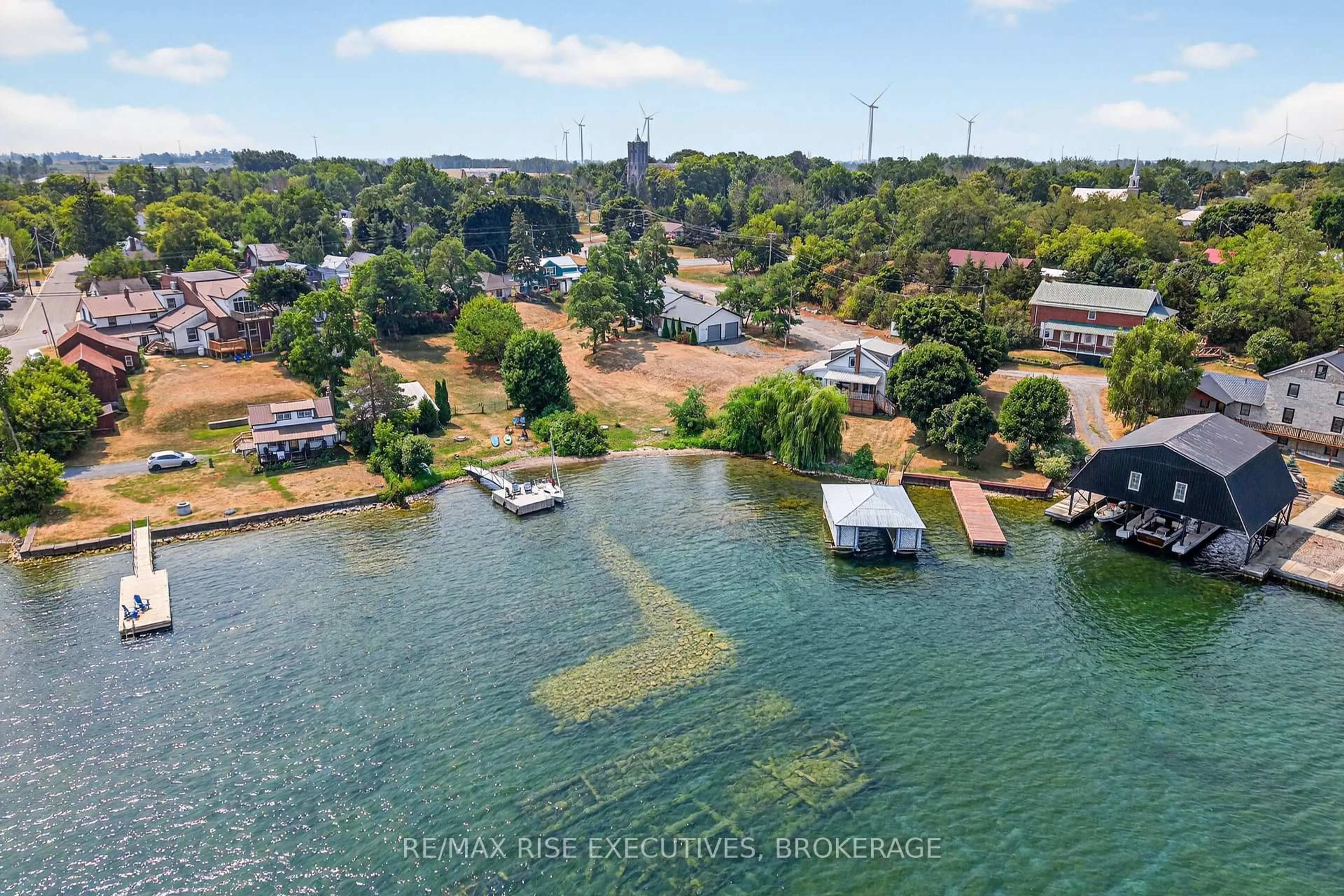 A pic from outside/outdoor area/front of a property/back of a property/a pic from drone, water/lake/river/ocean view for 14 Highway 95, Wolfe Island Ontario K0H 2Y0