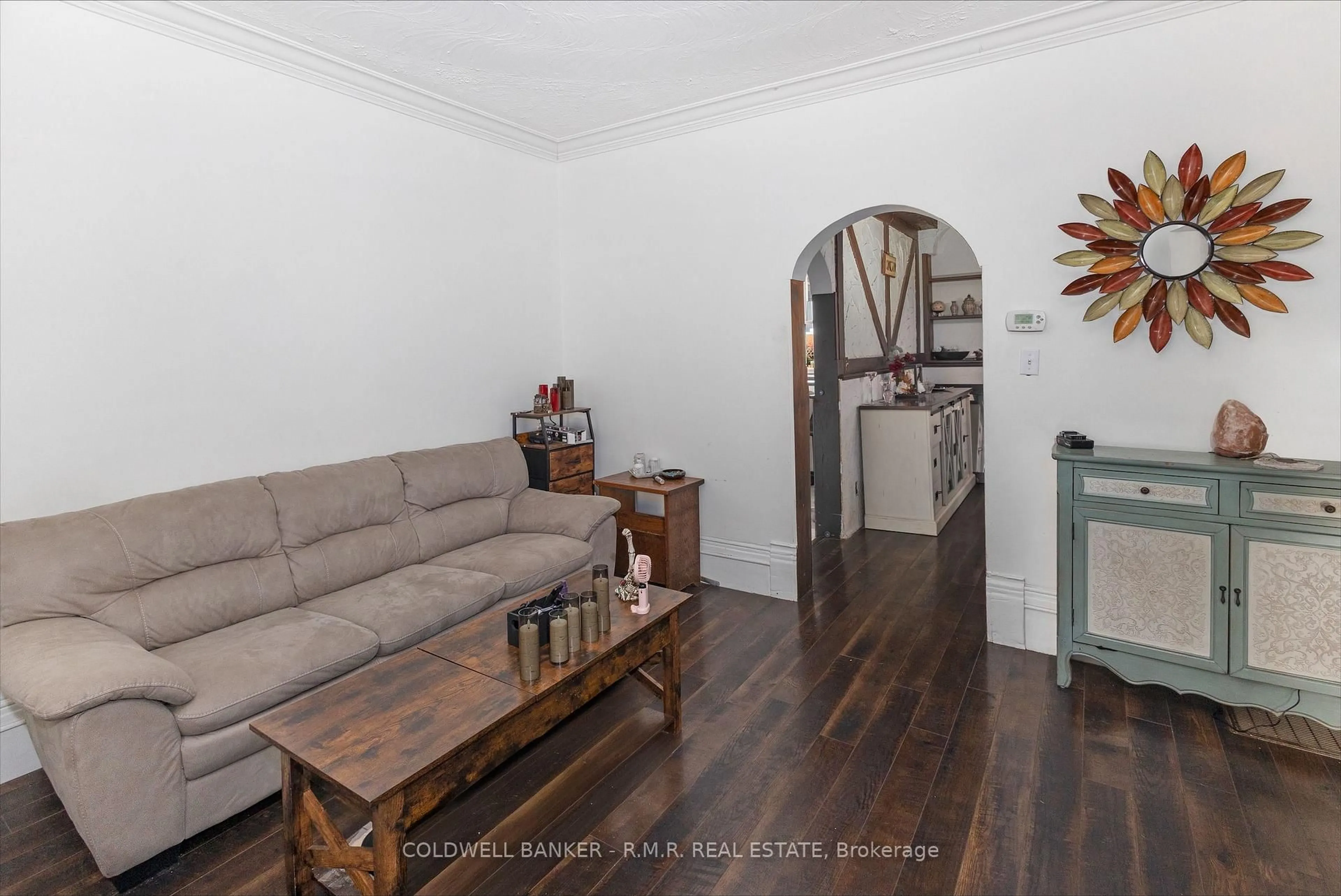 Living room with furniture, wood/laminate floor for 52 Glenelg St, Kawartha Lakes Ontario K9V 1Z3