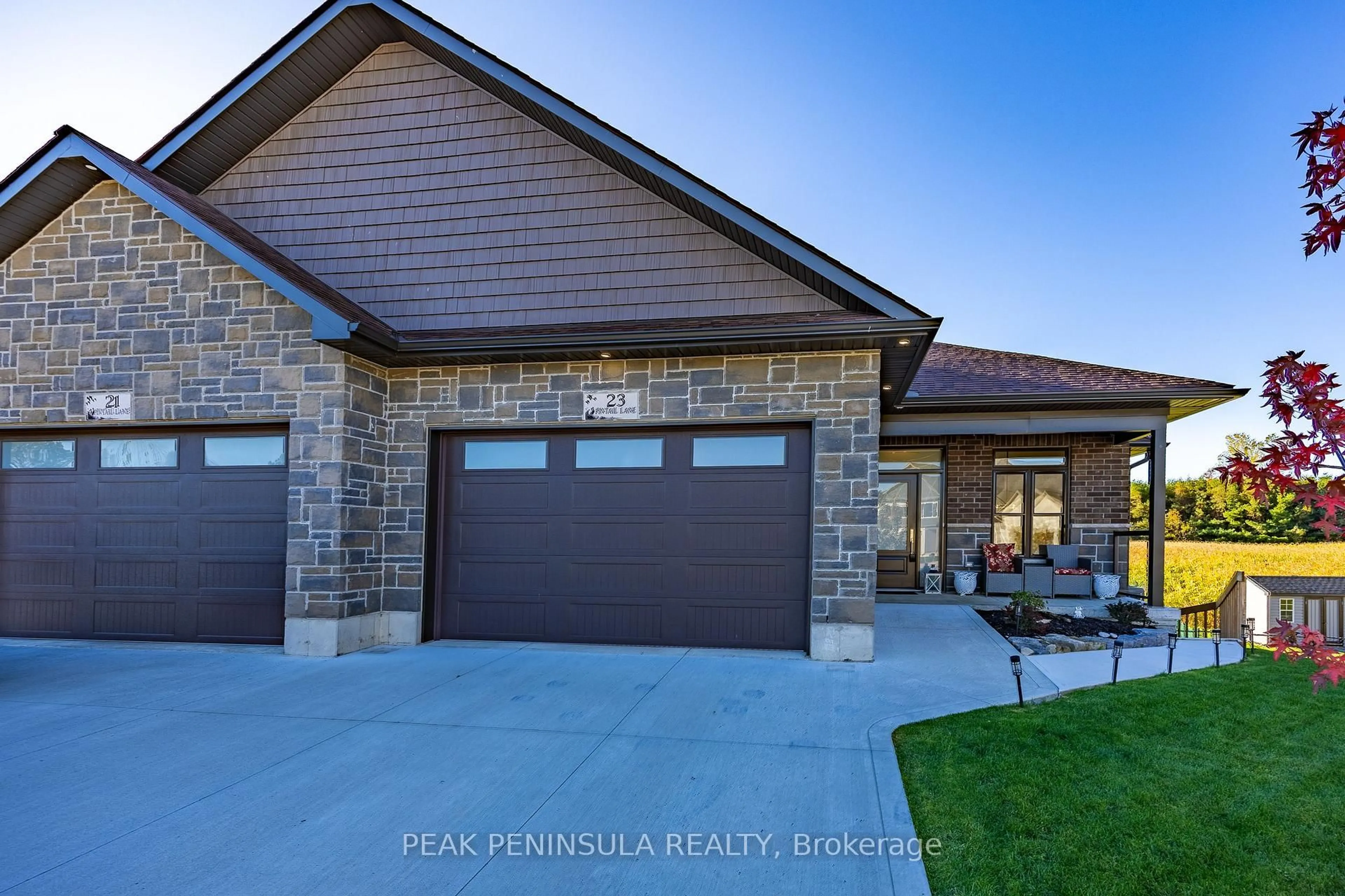 Home with brick exterior material, street for 23 Pintail Lane, Norfolk Ontario N0E 1M0