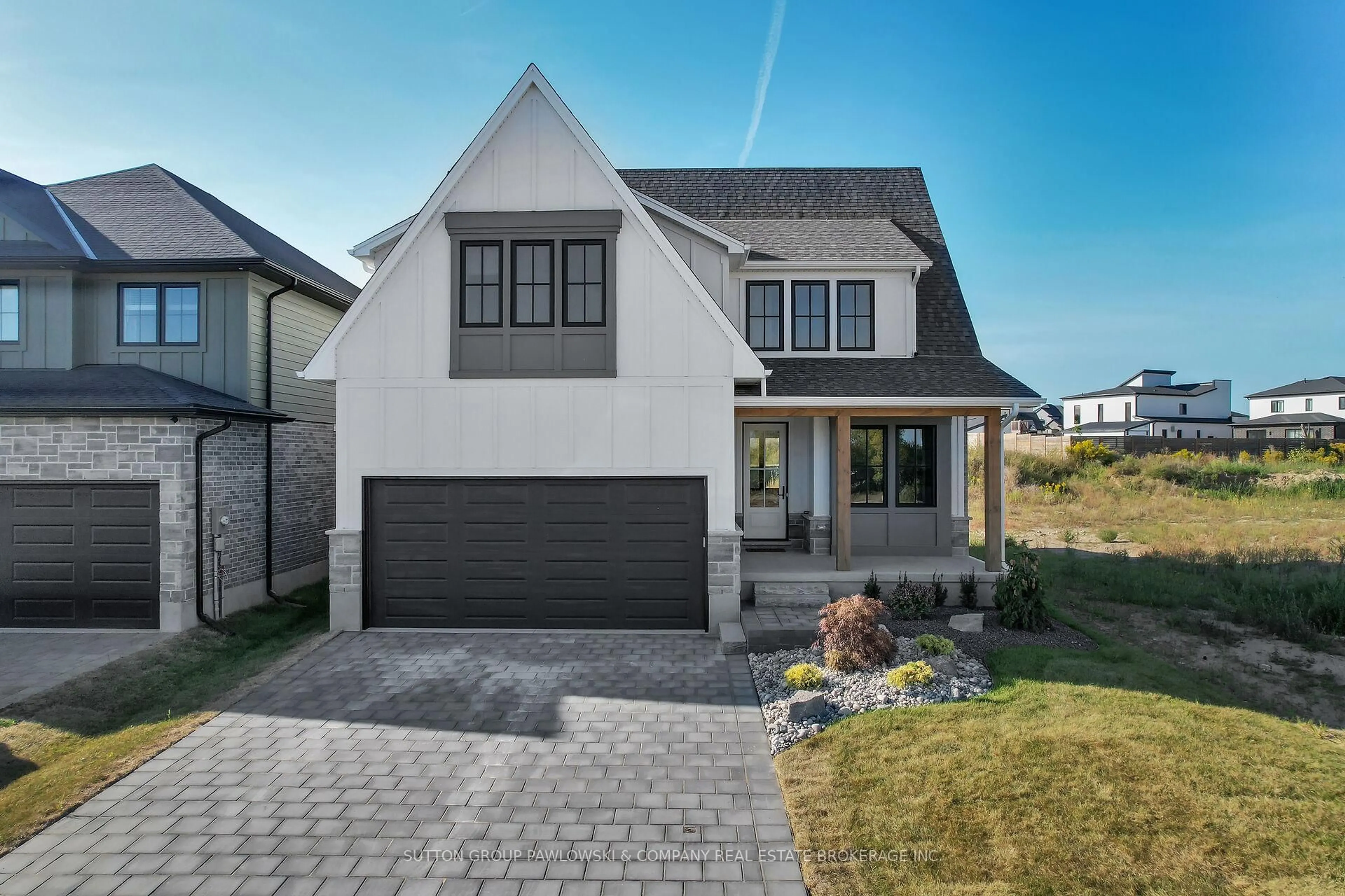 Home with brick exterior material, street for 87 ALLISTER Dr #Lot #22, Middlesex Centre Ontario N0L 1R0