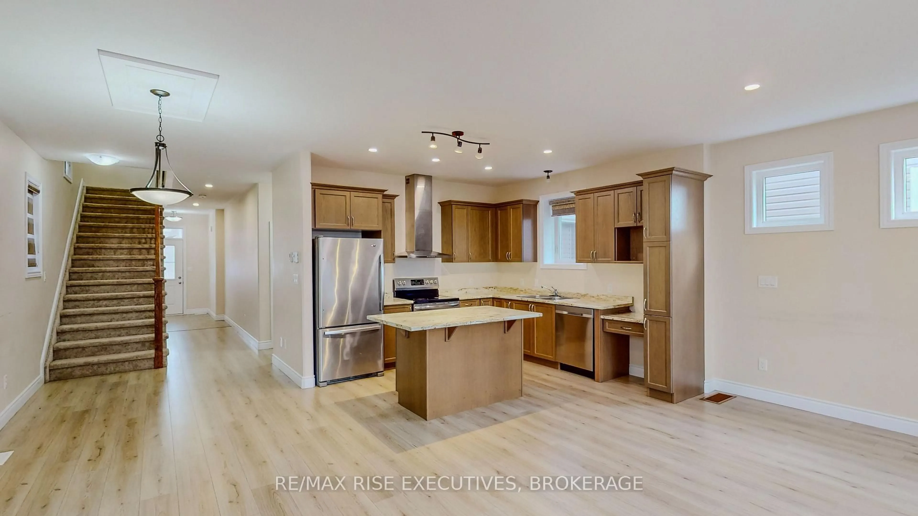 Open concept kitchen, wood/laminate floor for 467 Beth Cres, Kingston Ontario K7P 0K9