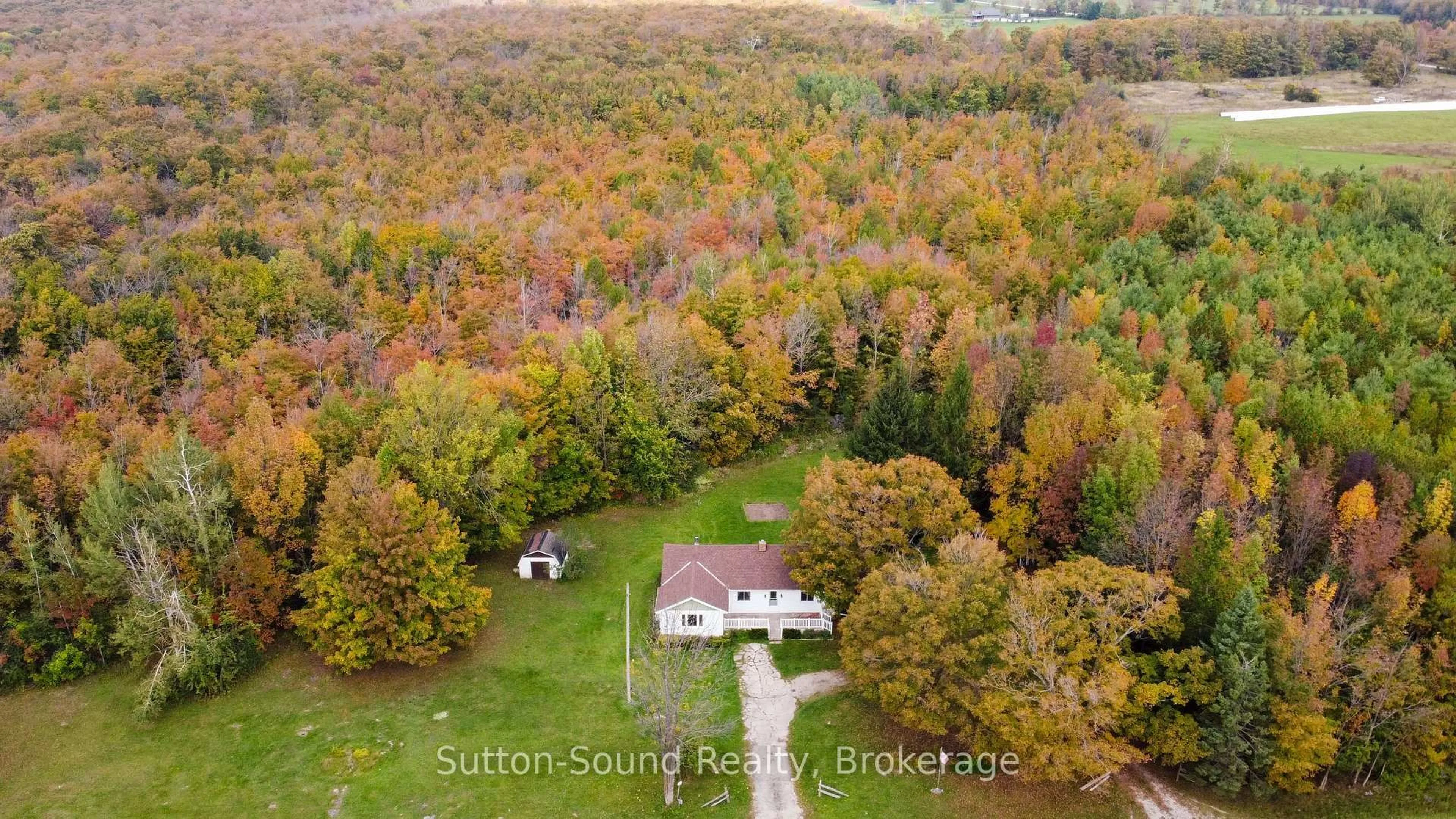 A pic from outside/outdoor area/front of a property/back of a property/a pic from drone, water/lake/river/ocean view for 204521 Highway 26, Meaford Ontario N4K 5W4